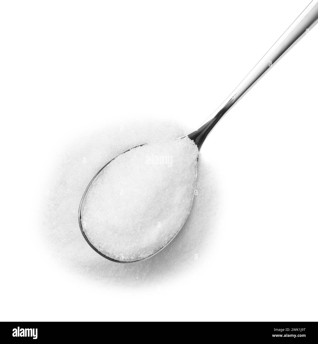 Spoon with granulated sugar isolated on white, top view Stock Photo
