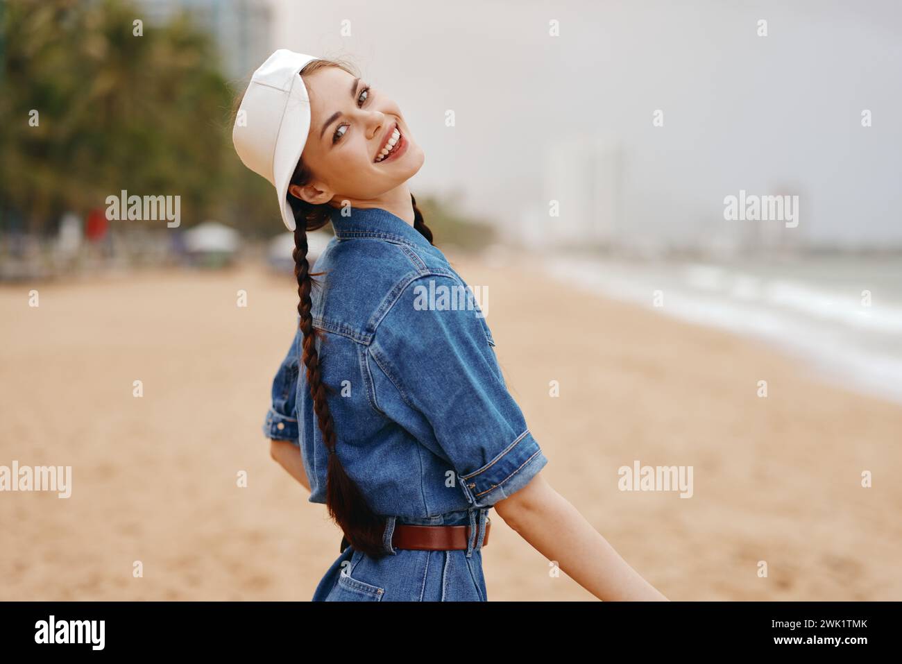 Summer Female Model Summer Style: Attractive Young Female Model Posing outdoors in a Blue ...
