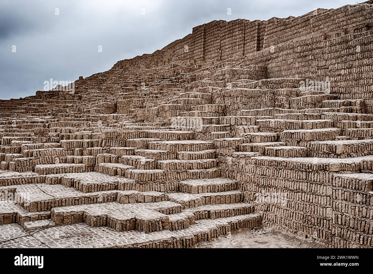 The Huaca Pucllana pyramid is constructed with tiers of adobe bricks as it rises to the sky in Lima. Stock Photo