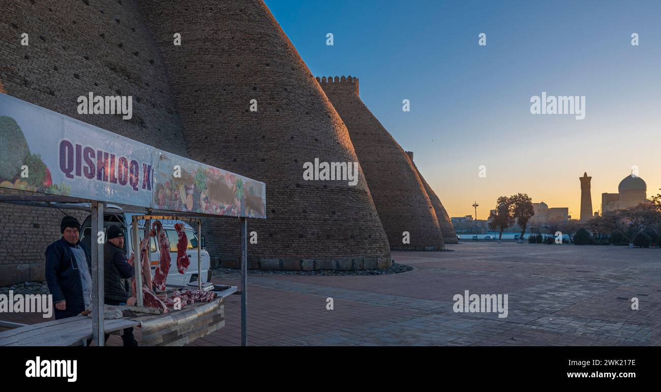 Butcher's stall at sunrise in the streets of Bukhara, Uzbekistan Stock ...