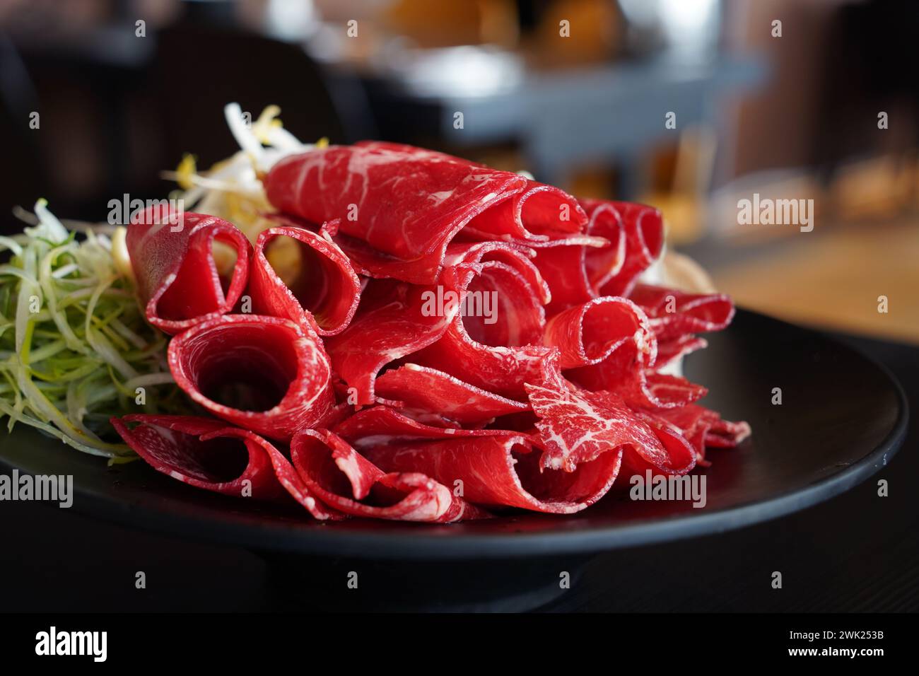 Thinly sliced raw red beef for shabu-shabu Stock Photo