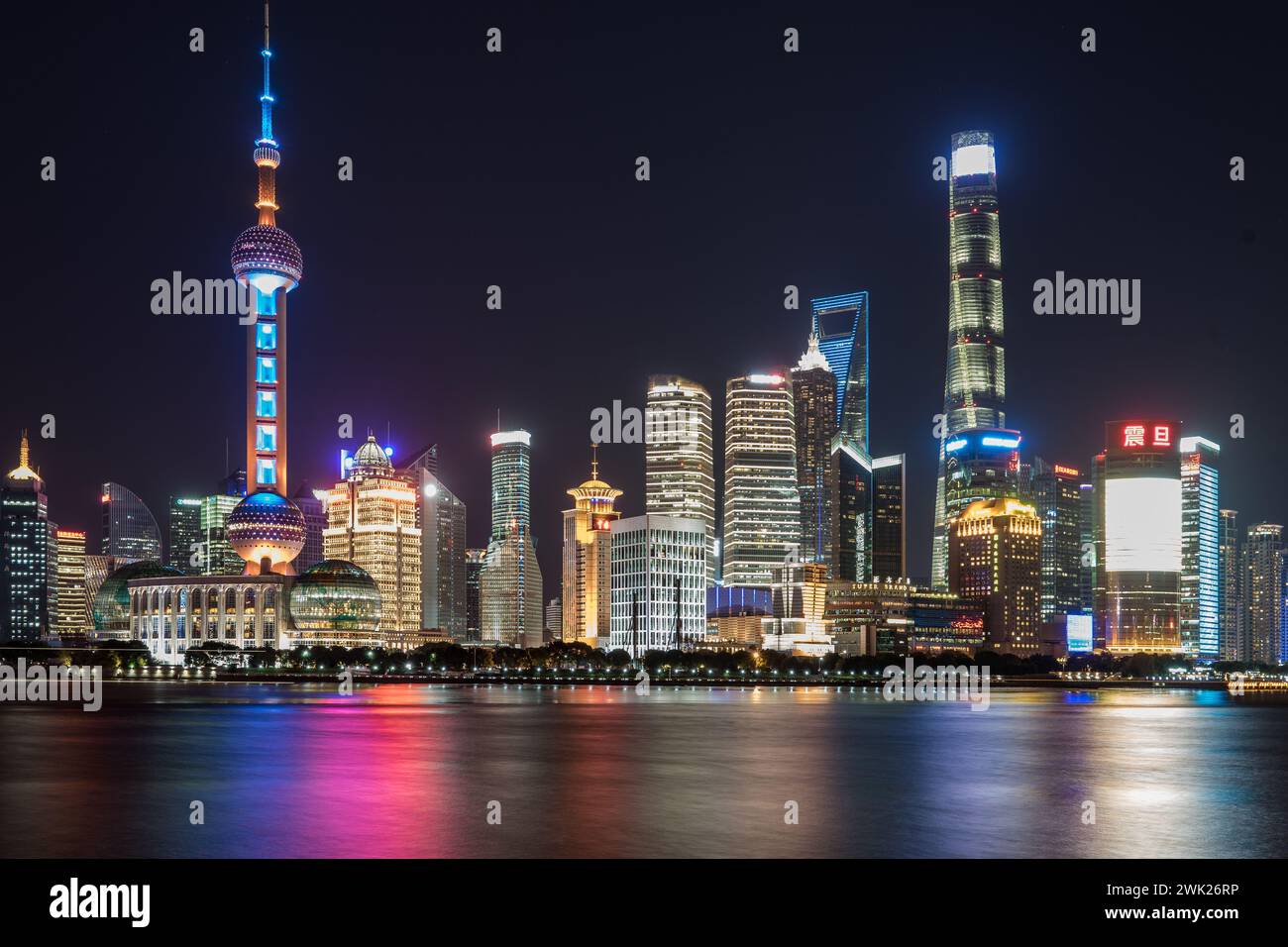 City skyline illuminated with blue and red lights Stock Photo