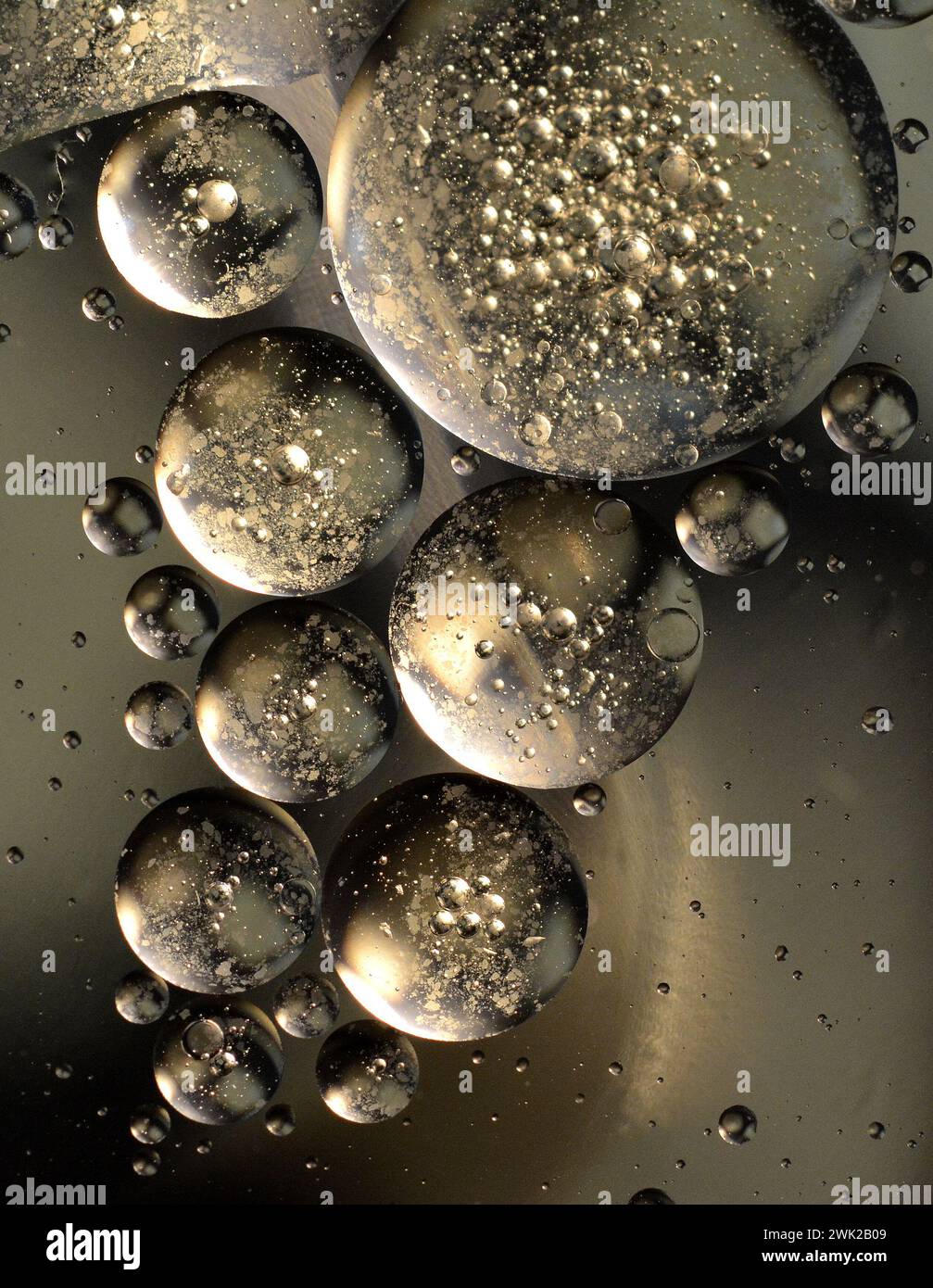 Abstract oil bubbles on water with reflections of colors and patterns. Abstract background. Abstract screensaver. Abstract artwork. Stock Photo