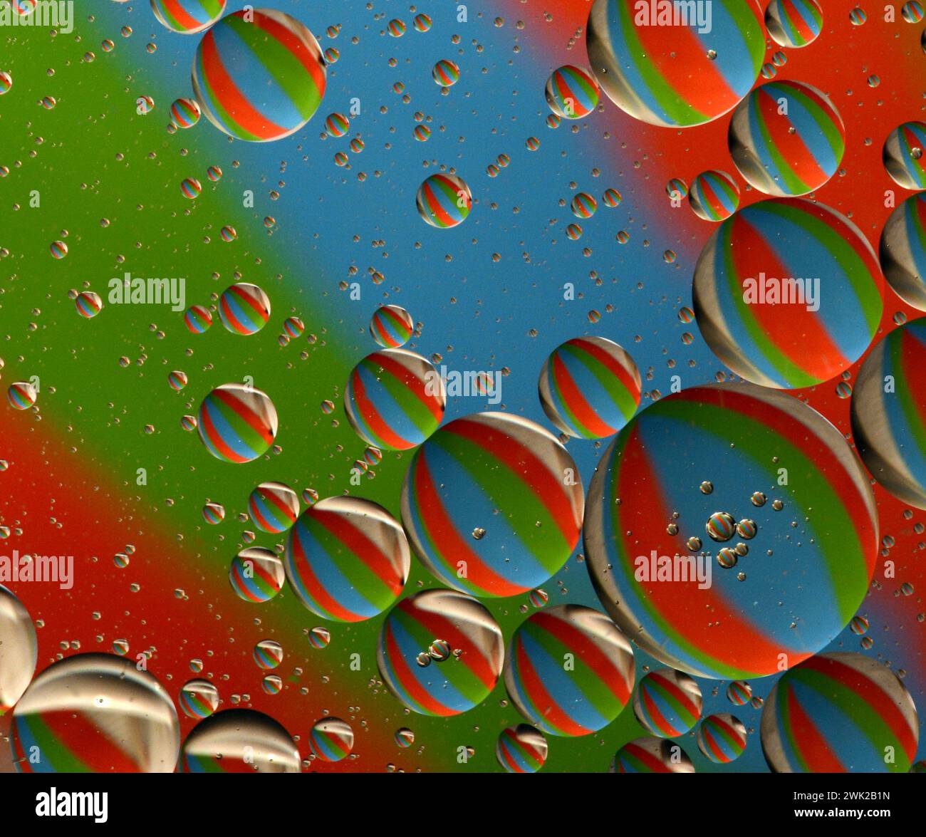 Abstract oil bubbles on water with colorful reflections and patterns. Abstract background. Abstract screensaver. Abstract artwork. Stock Photo