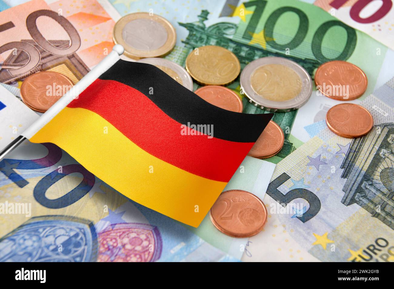 Euro banknotes and coins with German Flag Stock Photo