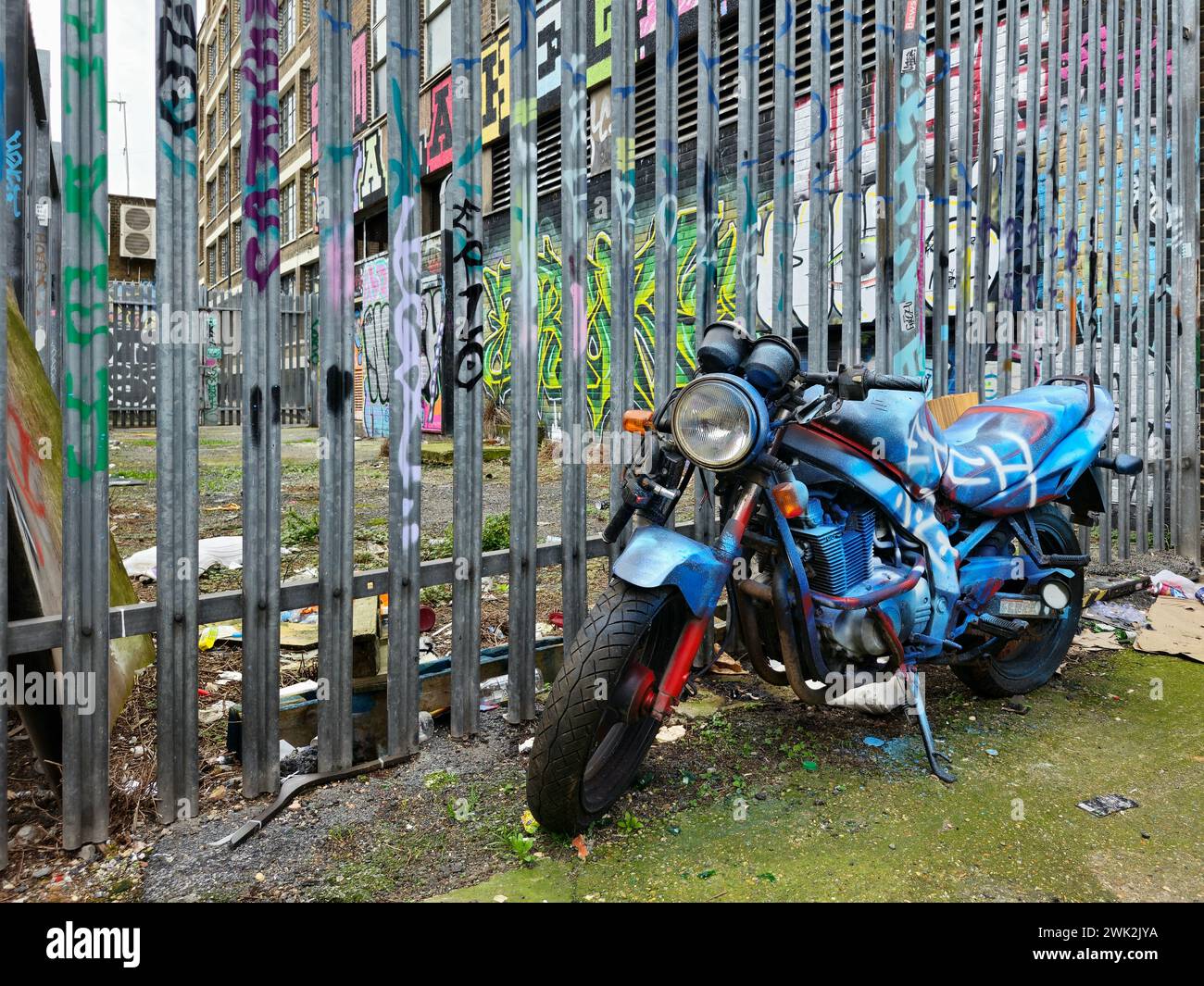 Abandoned motorbike covered in graffiti in Shoreditch, East London ...