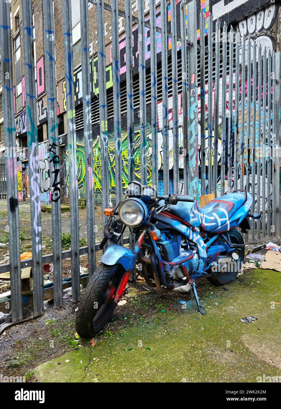 Abandoned motorbike covered in graffiti in Shoreditch, East London ...
