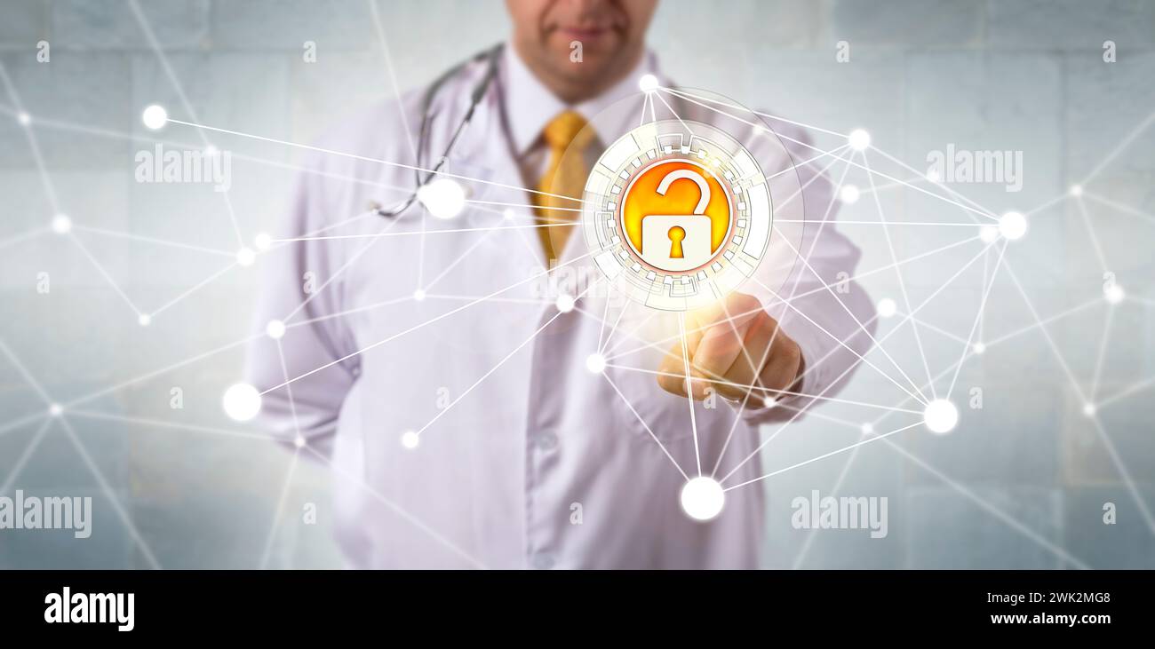 Unrecognizable male doctor of medicine accessing medical records via a secure communication network. Information technology and healthcare concept for Stock Photo