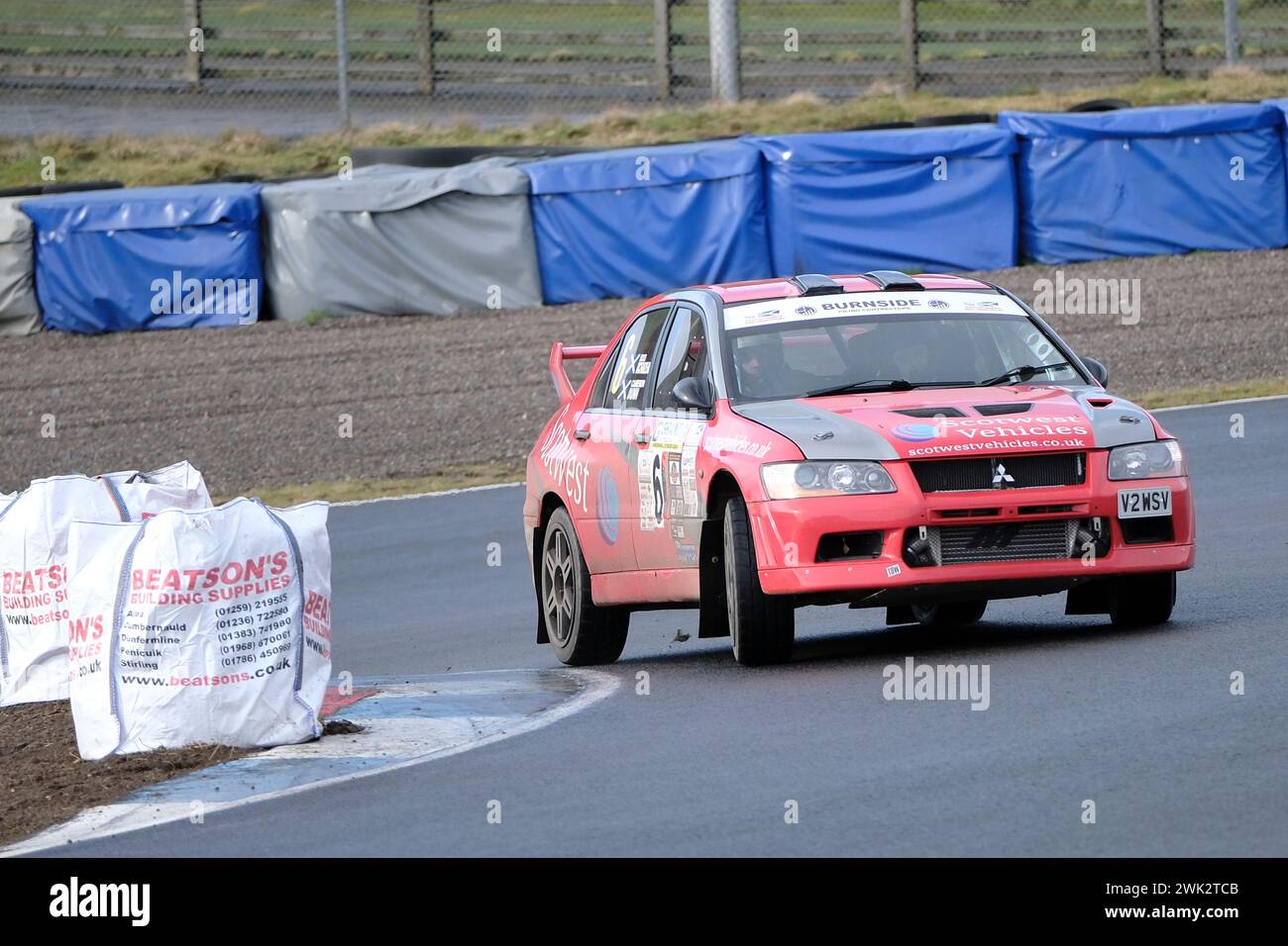 Dunfermline, UK. 18th Feb, 2024. Competitors take part in the single venue rally event, organised by Border Ecosse Car Club at Knockhill Racing Circuit, Dunfermline, Fife. The Grant Construction, tarmac rally with crews tackling 40 stage miles over 8 stages with multiple cars on the stages at the same time. Car/Driver/Navigator, Vehicle, Class Ross McFadzean, Cameron Dunn, Mitsubishi Evo, Class 5 ( Credit: Rob Gray/Alamy Live News Stock Photo