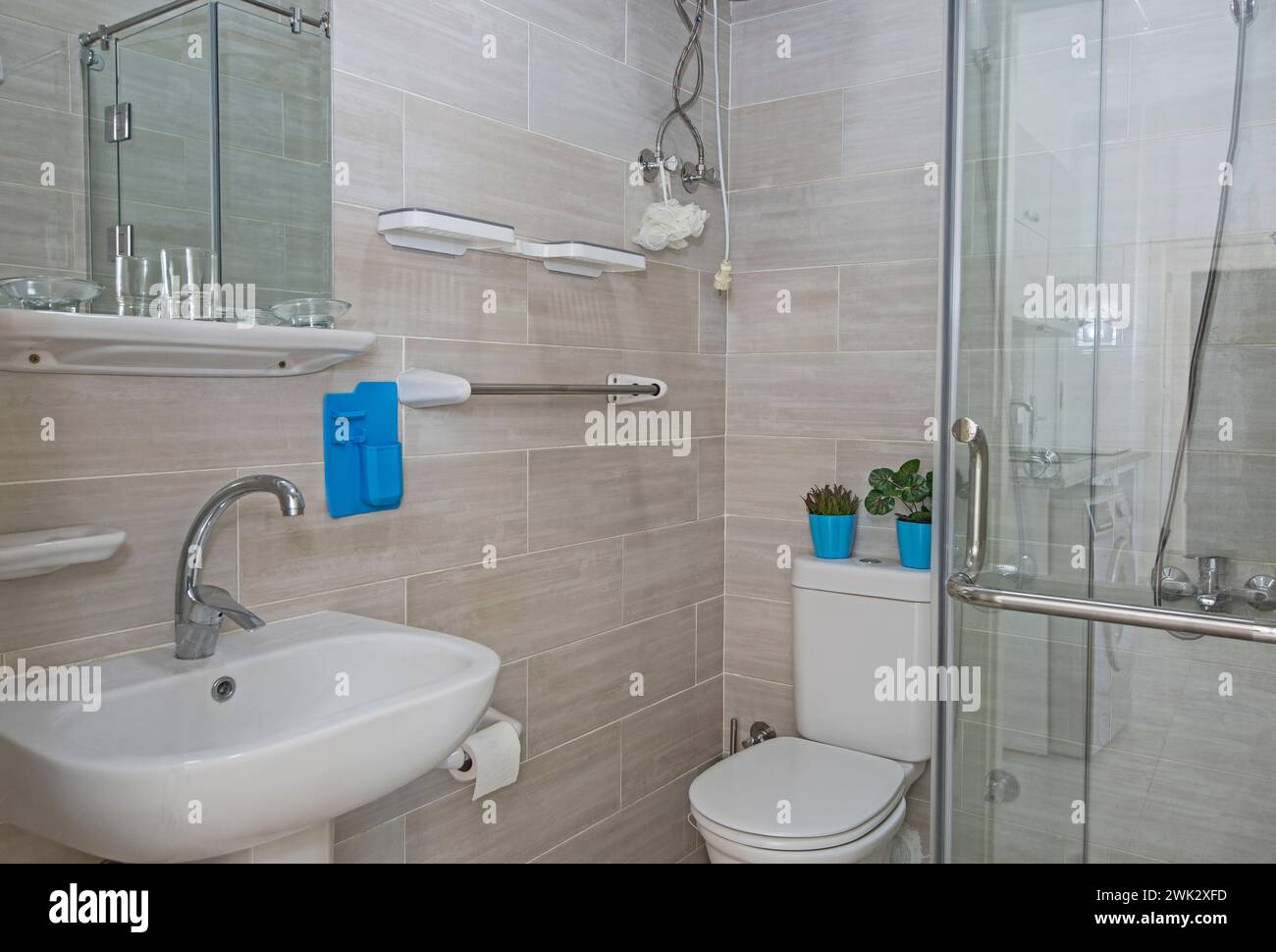 Interior design of a luxury show home apartment bathroom with shower cubicle and sink Stock Photo