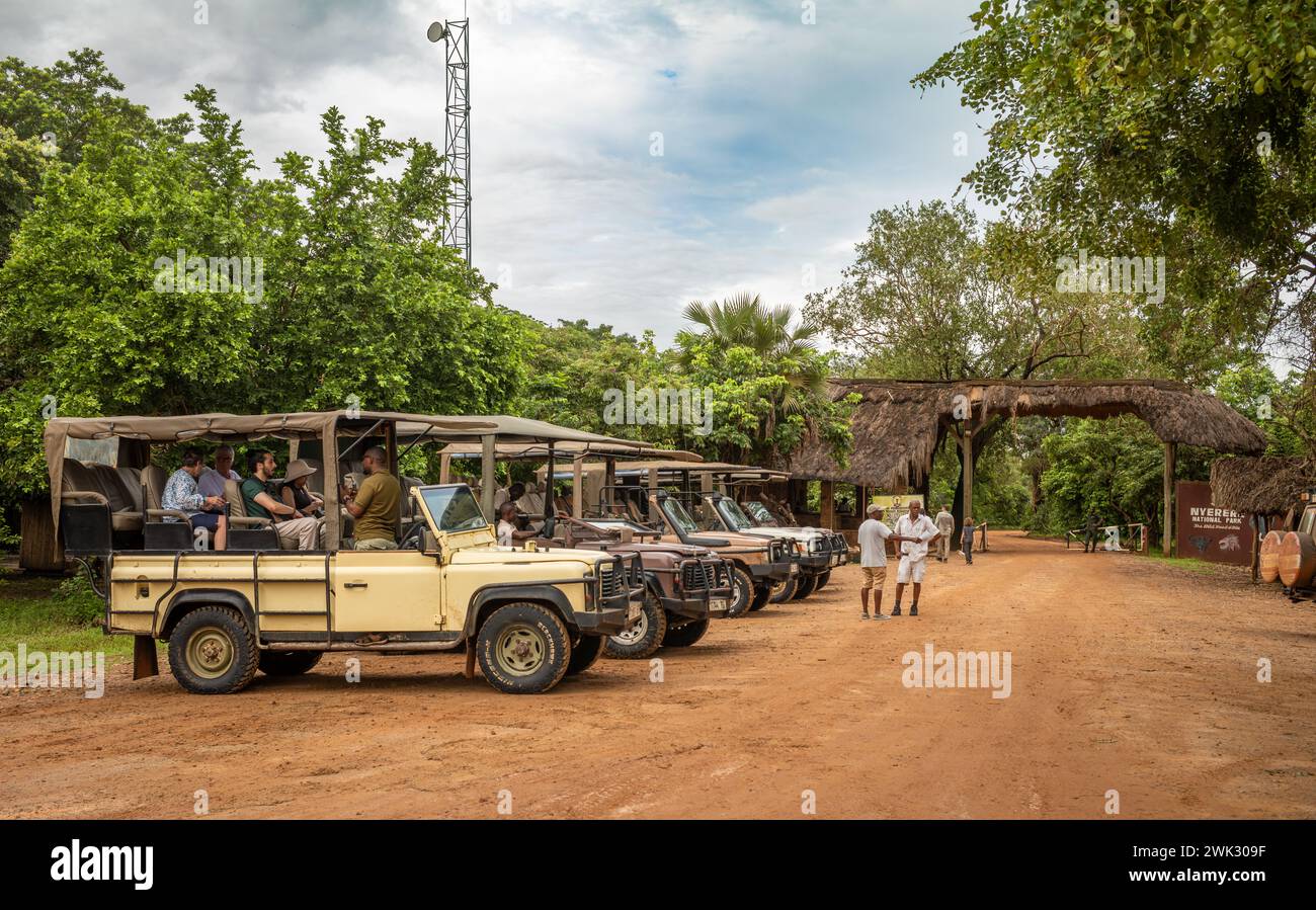 4-wheel drive vehicles with day-trip tourists at Mtemere airstrip and the entrance to Nyerere National Park (Selous Game Reserve) in Tanzania. Stock Photo