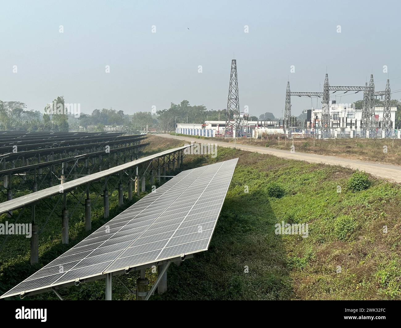 (240218) -- DHAKA, Feb. 18, 2024 (Xinhua) -- This photo taken on Feb. 17, 2024 shows a 50 MW Chinese-built photovoltaic power plant in Mymensingh District, Bangladesh. The Mymensingh district in north-central Bangladesh enjoys better sunshine than any other place in the South Asian country.The 50 MW photovoltaic power plant invested by HDFC SinPower Ltd. whose major shareholder is China Huadian Overseas Investment Co., Ltd. started construction in September 2019 to utilize the advantage of solar resources here. Overcoming difficulties during the construction, the project was put into commercia Stock Photo