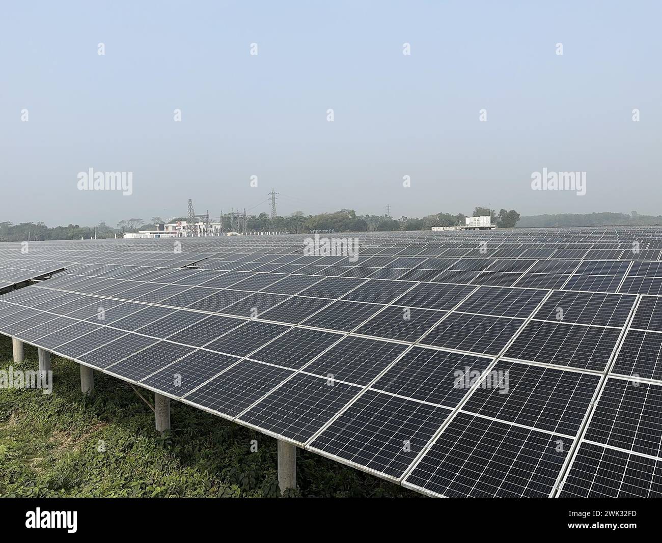 (240218) -- DHAKA, Feb. 18, 2024 (Xinhua) -- This photo taken on Feb. 17, 2024 shows a 50 MW Chinese-built photovoltaic power plant in Mymensingh District, Bangladesh. The Mymensingh district in north-central Bangladesh enjoys better sunshine than any other place in the South Asian country.The 50 MW photovoltaic power plant invested by HDFC SinPower Ltd. whose major shareholder is China Huadian Overseas Investment Co., Ltd. started construction in September 2019 to utilize the advantage of solar resources here. Overcoming difficulties during the construction, the project was put into commercia Stock Photo