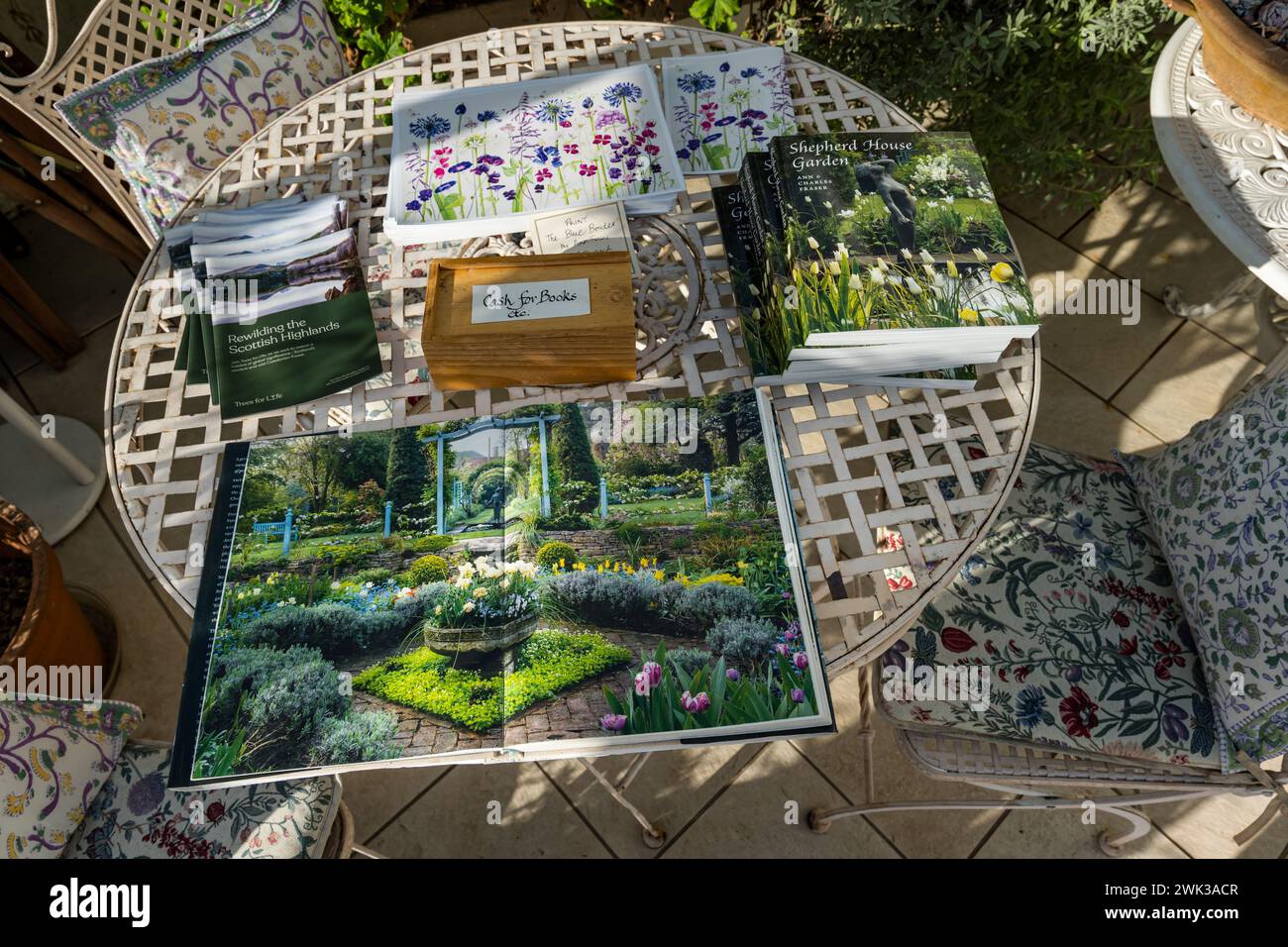 Shepherd House garden, Inveresk, East Lothian, Scotland, UK 18th February 2024. Scotland's Garden Scheme Snowdrop Weekend: the garden is open to the public with entrance donations going to charity.  Pictured: a book about the garden is for sale. Credit: Sally Anderson/Alamy Live News Stock Photo