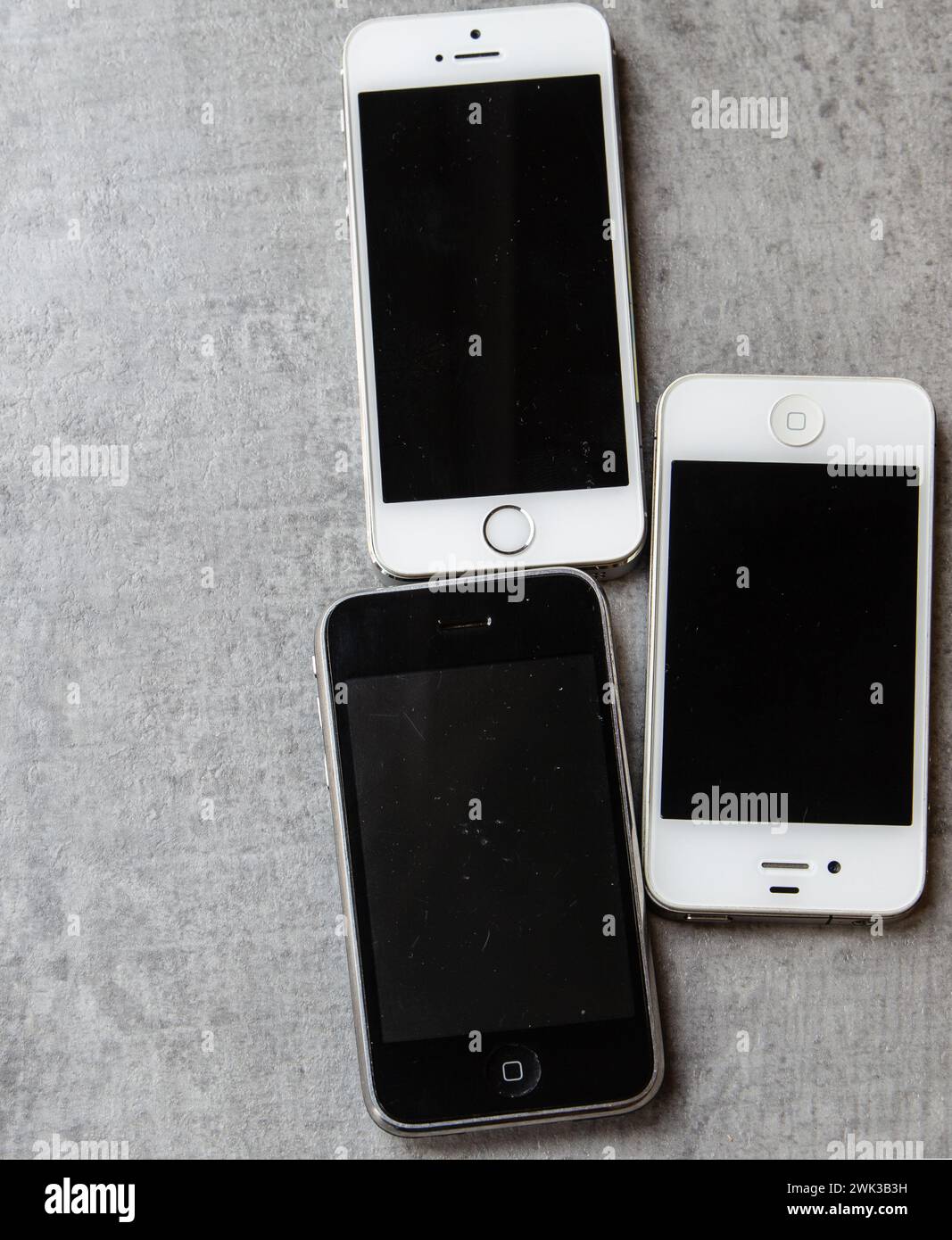 Older used Apple iPhones 3GS 5s and 4 Stock Photo