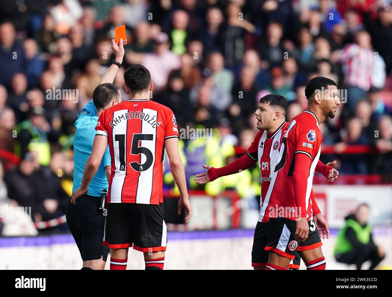 Sheffield United's Mason Holgate shown a red card by referee Stuart Attwell after a VAR decision during the Premier League match at Bramall Lane, Sheffield. Picture date: Sunday February 18, 2024. Stock Photo