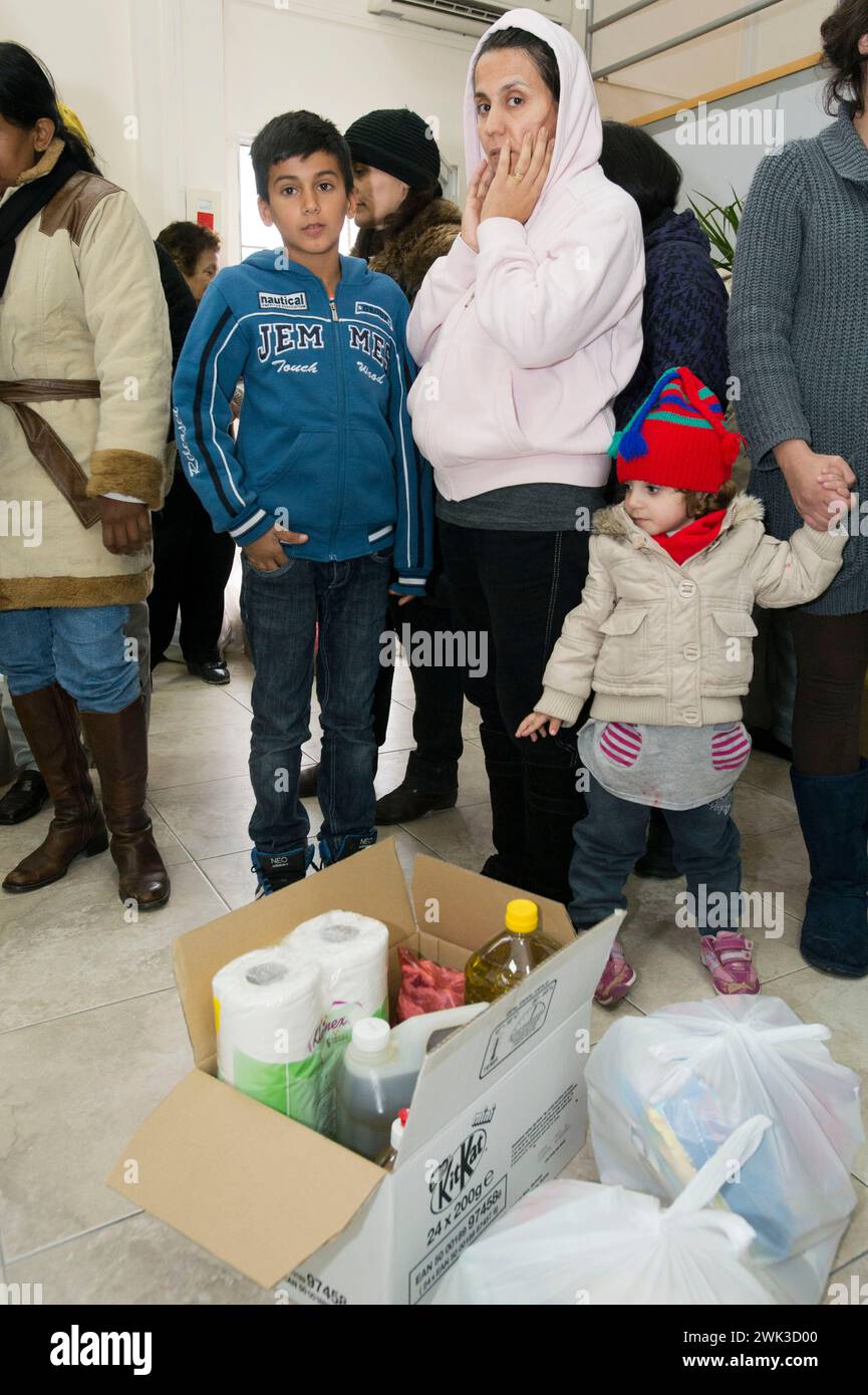 In the village of Latsia, near Nicosia, people with very low income receiving free food donated by the Church of Cyprus. Stock Photo
