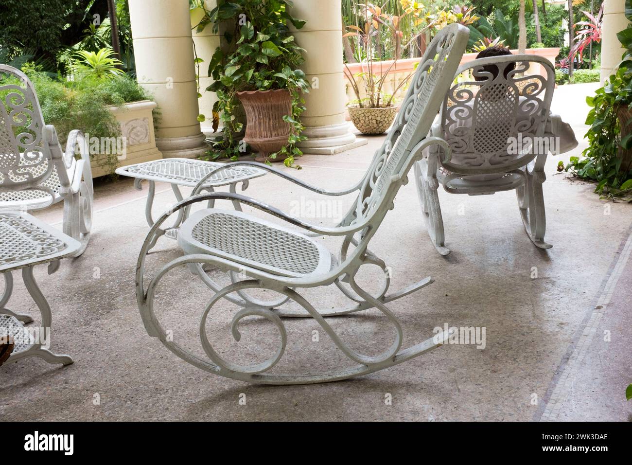 A rocking chair on the terrace of the house of the Cuban artists' association UNEAC in Havana. Stock Photo