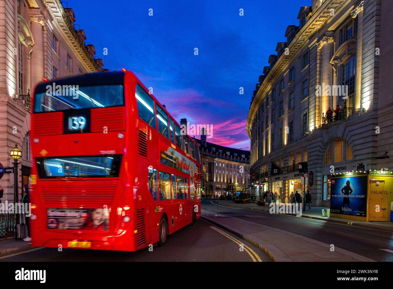 A blurred bus and a dramatic sunset on Regent Street, Central London ...