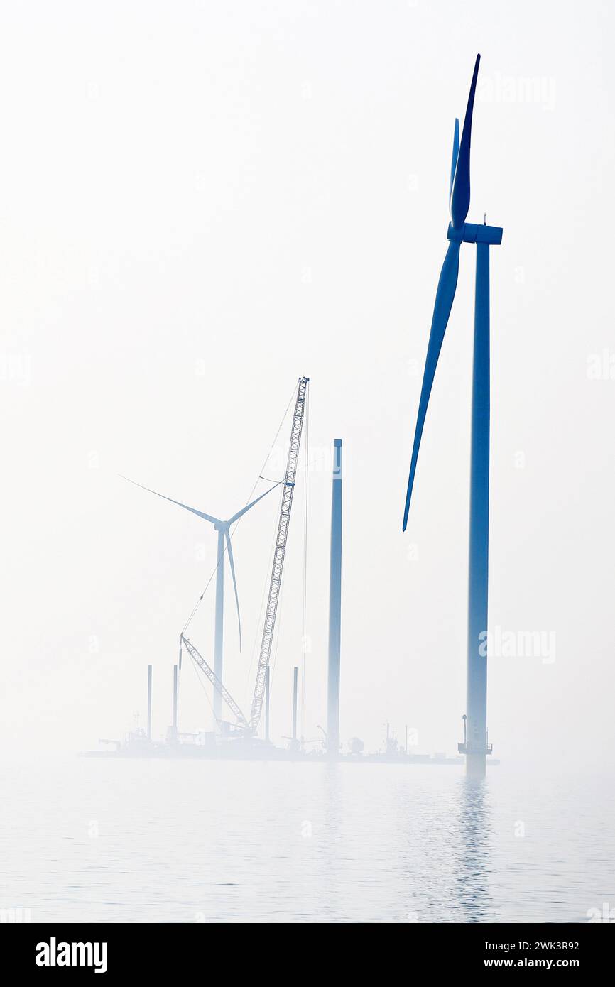 A transport ship and crane for the construction of an offshore windpark, Ijsselmeer The Netherlands Stock Photo