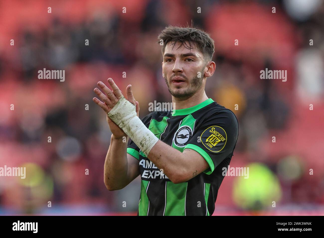 Billy Gilmour of Brighton & Hove Albion applauds the travelling fans after the game during the Premier League match Sheffield United vs Brighton and Hove Albion at Bramall Lane, Sheffield, United Kingdom, 18th February 2024  (Photo by Mark Cosgrove/News Images) Stock Photo