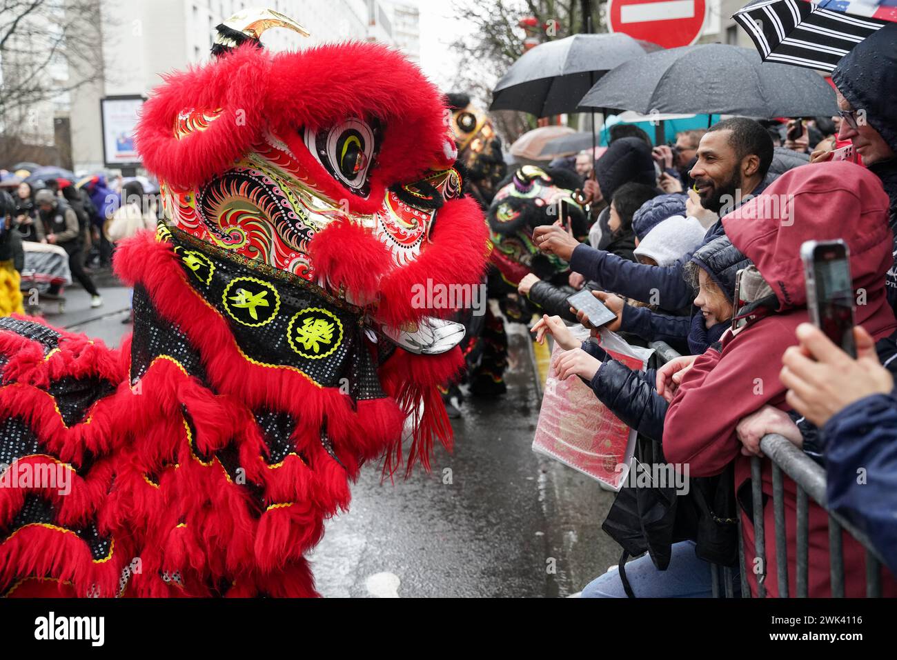 Paris, France, 18th February, 2024. Red dragon costume during Chinese New Year of the Dragon celebration - Jacques Julien/Alamy Live News Stock Photo