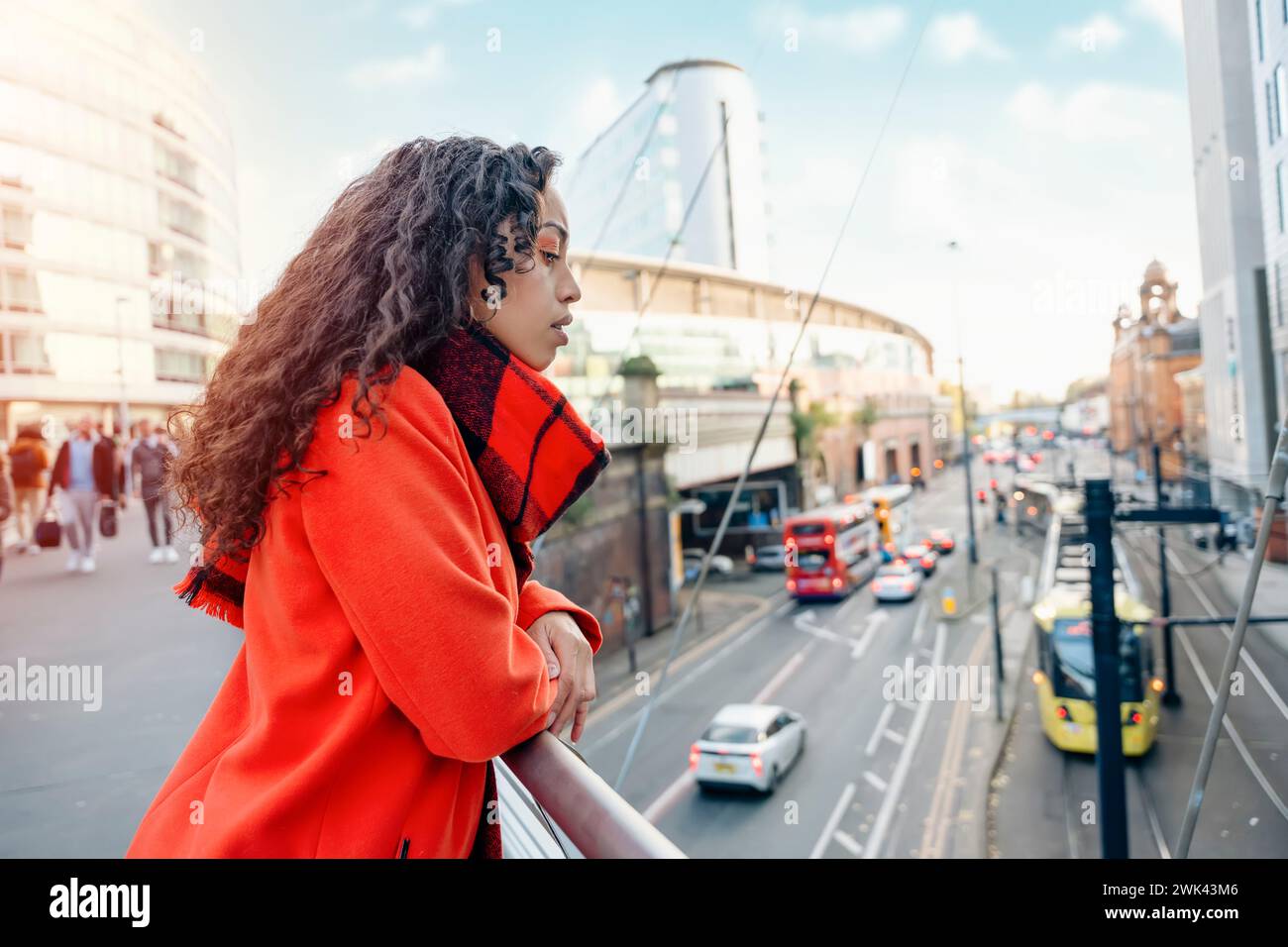 Woman in orange coat outside hi-res stock photography and images - Alamy