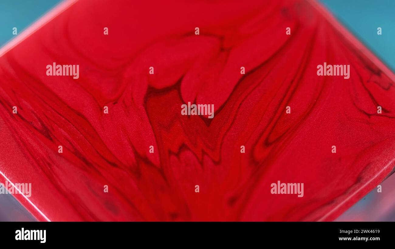 Liquid paint background red waves square surface Stock Photo