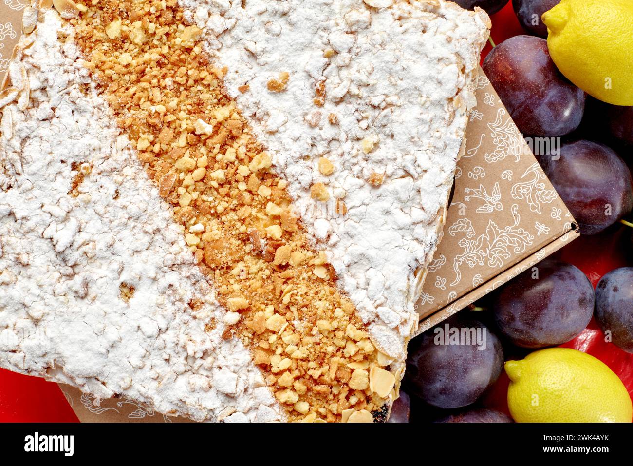 Sweet brioche galette with fruit confit, streusel, powdered sugar and