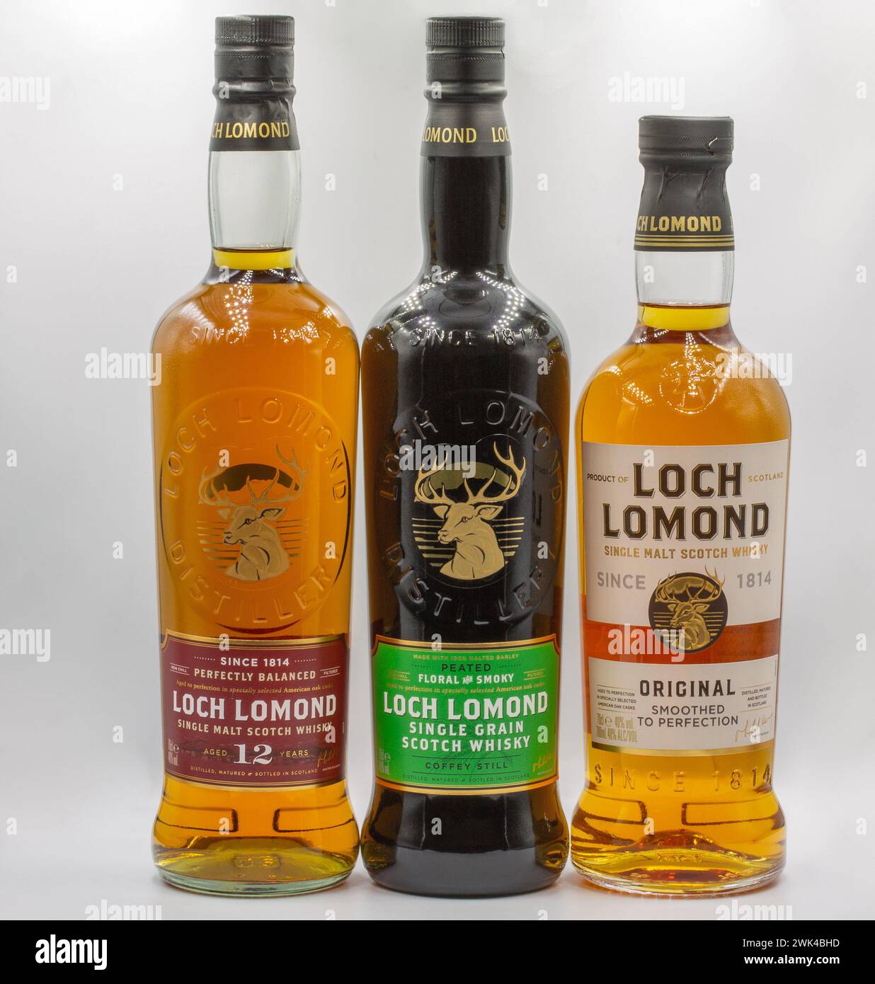 Kyiv, Ukraine - September 06, 2022: Studio shoot of Loch Lomond Single Malt and Single Grain Scotch whisky bottles closeup against white. It is a High Stock Photo
