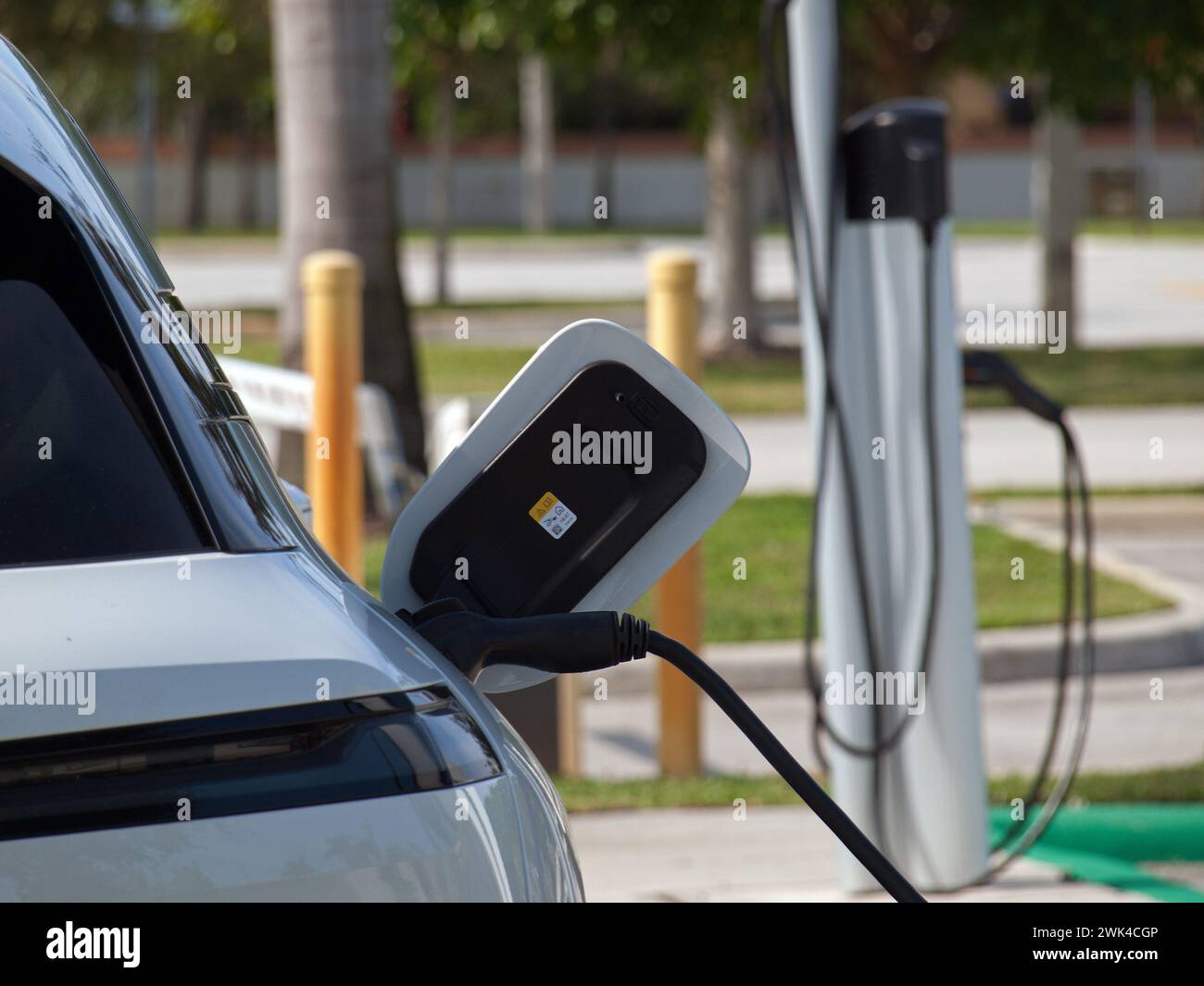 Miami, Florida, United States - November 28, 2023 - Electric vehicle connected to a ChargePoint EV Charging station. Stock Photo