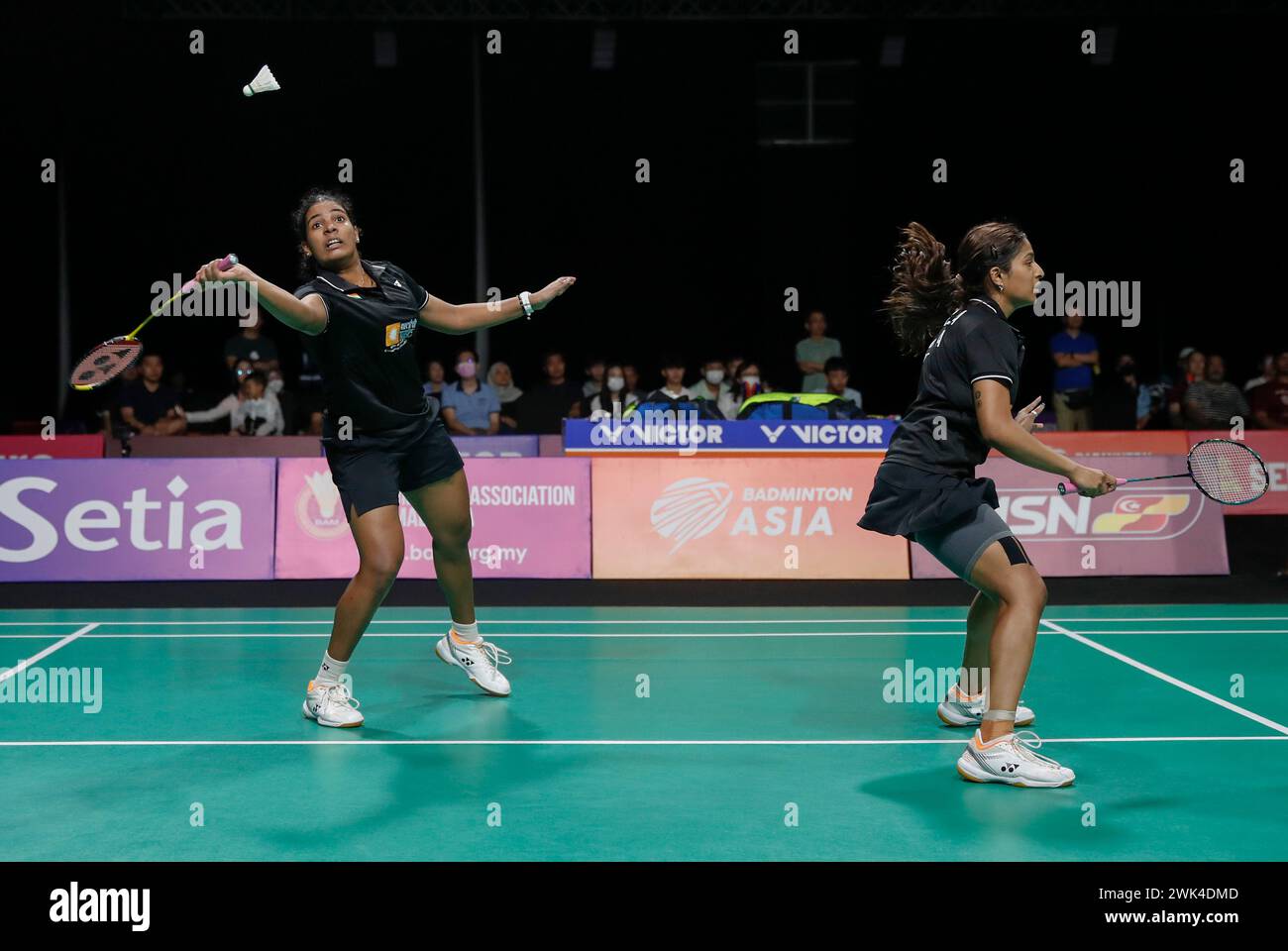 Kuala Lumpur, Malaysia. 18th Feb, 2024. Gayatri Gopichand Pullela and Treesa Jolly (L) of India in action against Jongkolphan Kititharakul and Rawinda Projongjai of Thailand (not pictured) during the Women's Doubles final match at the Badminton Asia Team Championships 2024 at Setia City Convention Centre in Shah Alam. Gayatri Gopichand Pullela and Treesa Jolly won with scores; 21/18/21 : 16/21/16. Credit: SOPA Images Limited/Alamy Live News Stock Photo