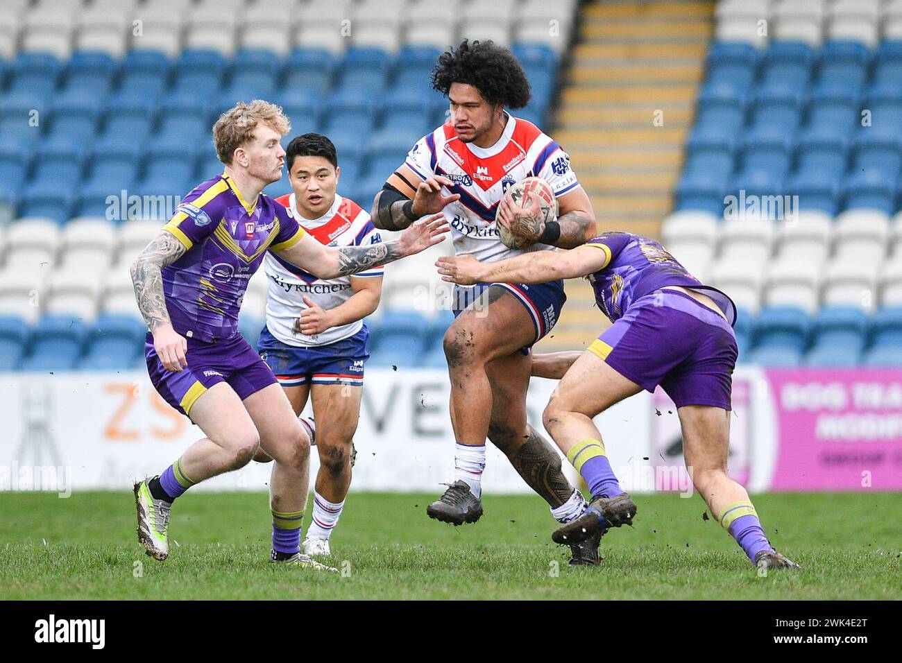 Featherstone, UK. 18th Feb, 2024. Wakefield Trinity's Renouf Atoni breaks through defensive line. Rugby League 1895 Cup, Newcastle Thunder vs Wakefield Trinity at Millenium Stadium, Featherstone, UK Credit: Dean Williams/Alamy Live News Stock Photo