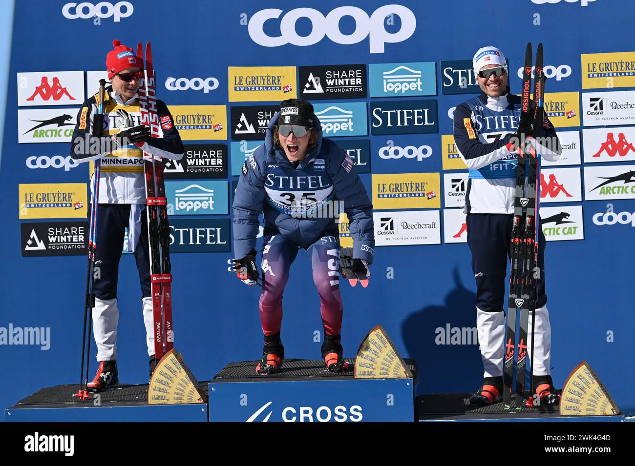 Minneapolis, Minnesota, USA, 18 February, 2024: American Gus Schumacher, center, reacts after winning the men's 10 K freestyle at Theodore Wirth Regional Park in Minneapolis, Minnesota, USA.  Left Harald Amundsen Norway second, right, Paal Golberg Norway third. Credit: John Lazenby/Alamy Live News Stock Photo