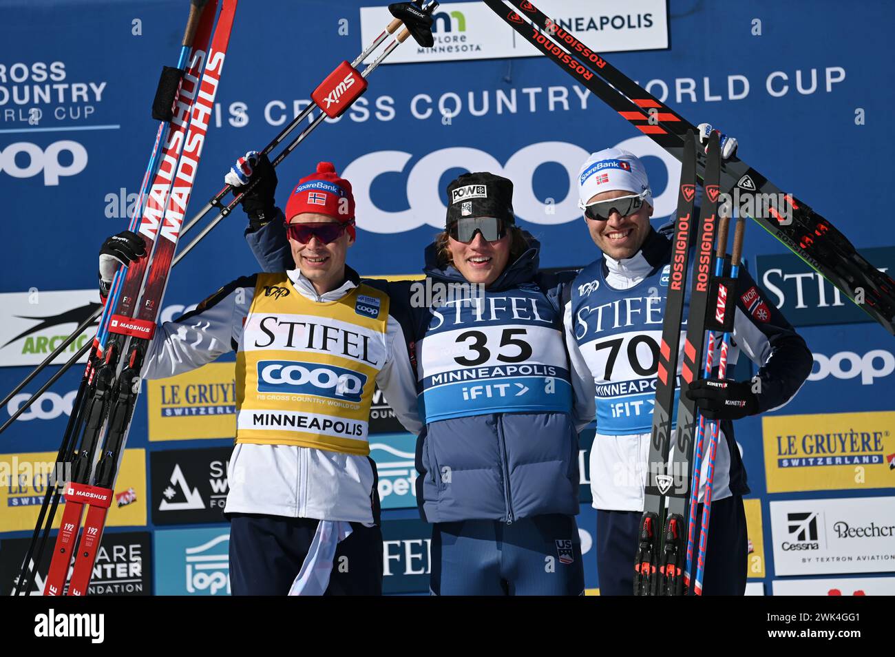 American Gus Schumacher, center, reacts after winning the men's 10 K freestyle at Theodore Wirth Regional Park in Minneapolis, Minnesota, USA.  Left Harald Amundsen Norway second, right, Paal Golberg Norway third. Stock Photo