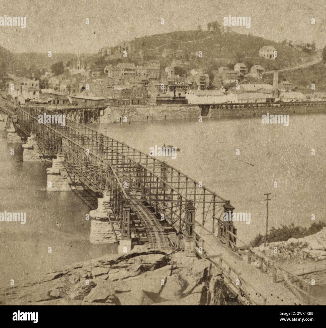 View of town, railroad, bridge, and river - Harper's Ferry, West Virginia, circa 1865 Stock Photo