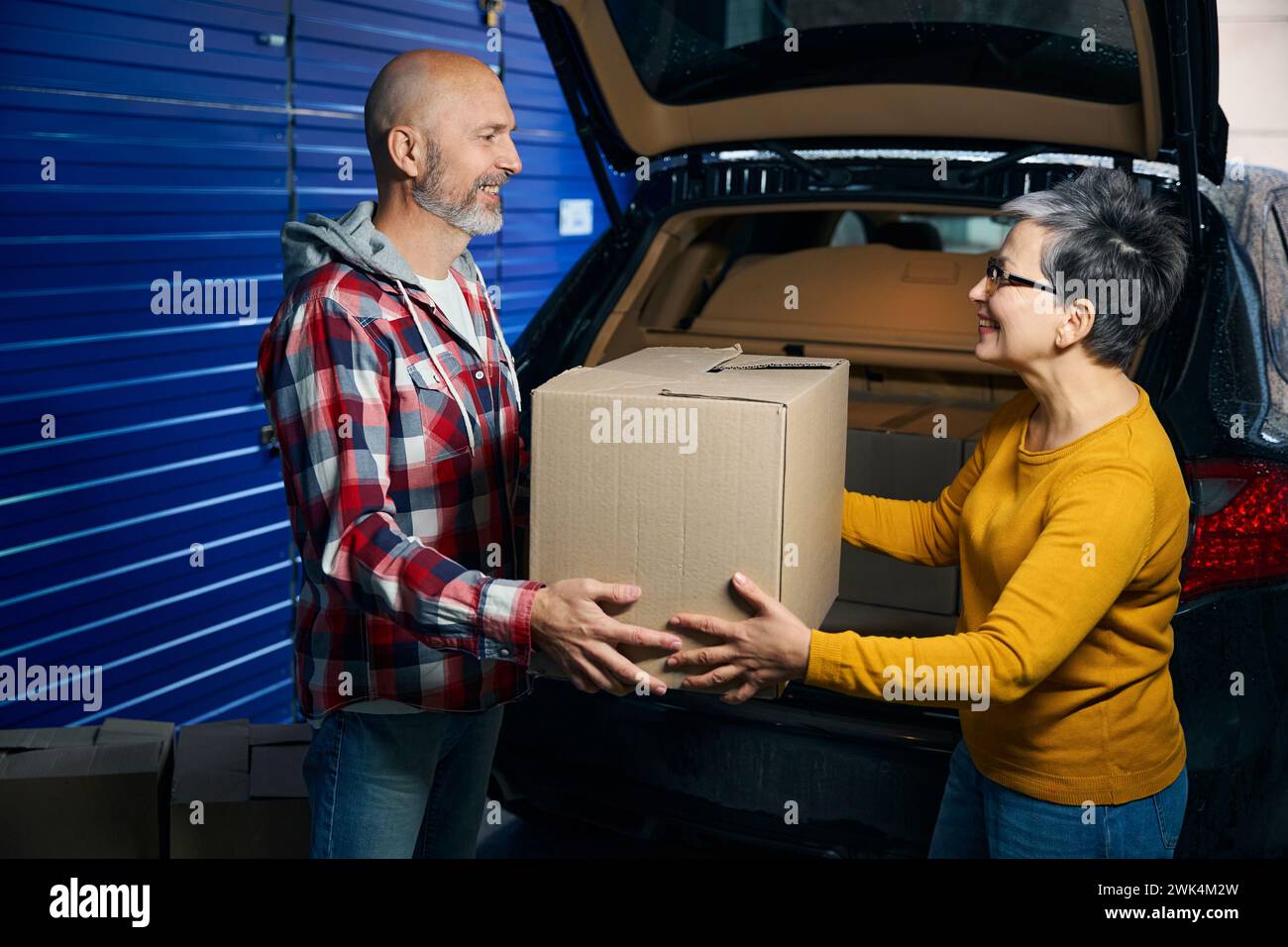 Woman takes from box hi-res stock photography and images - Alamy
