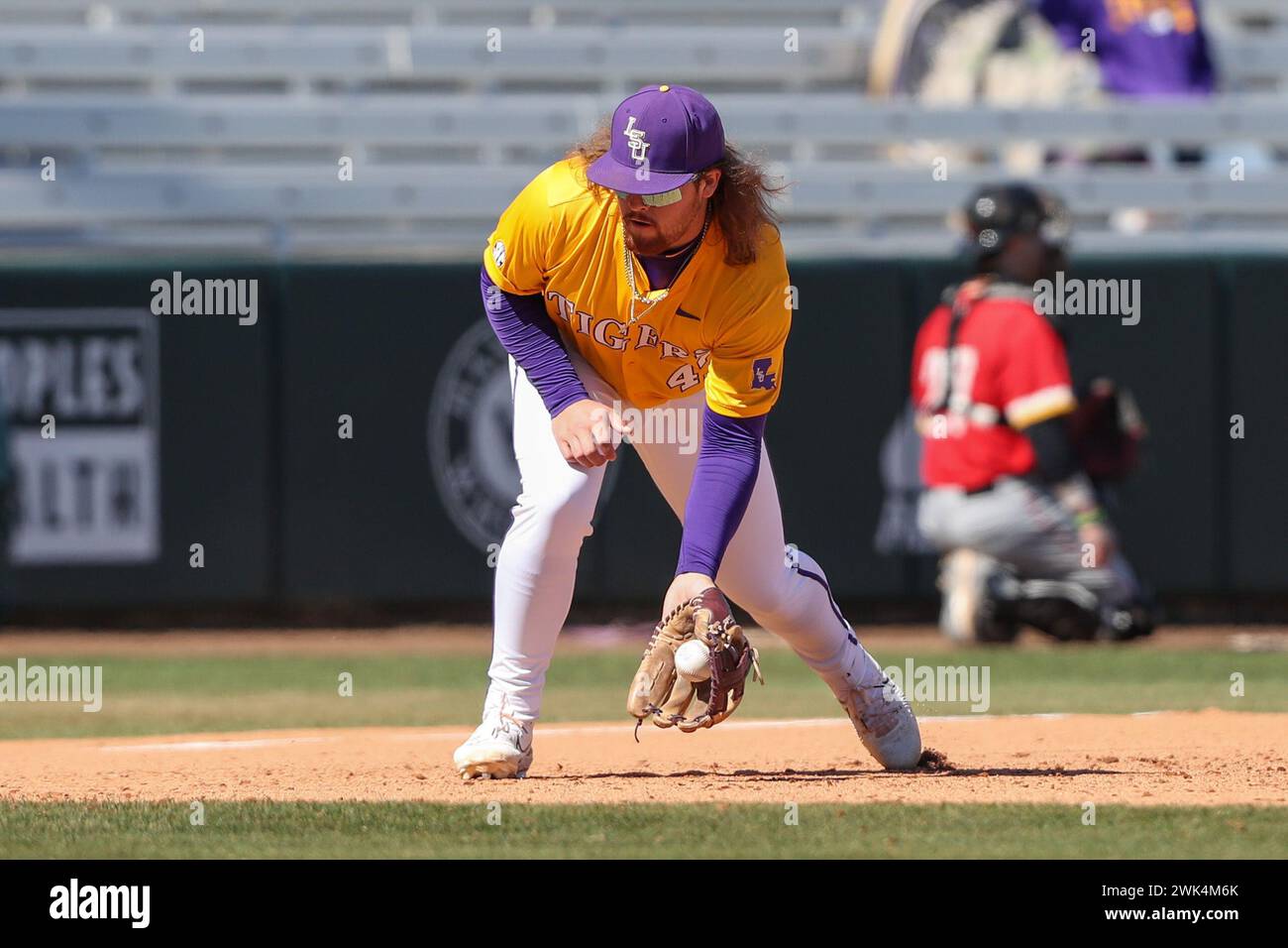 Baton Rouge, LA, USA. 18th Feb, 2024. LSU third baseman Tommy White (47) fields a ball in