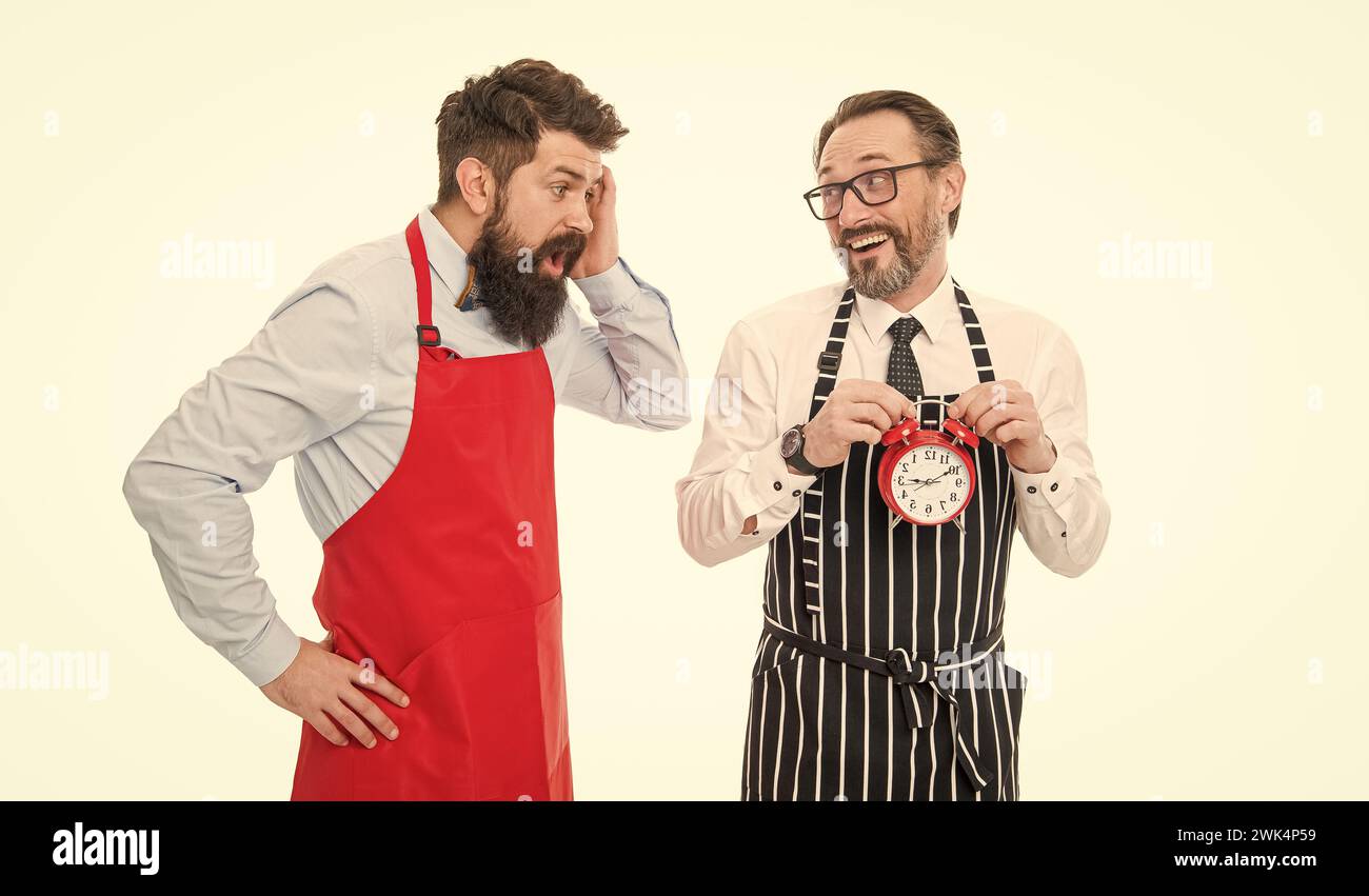 It is lunch time. Men cooks with alarm clock. Failed deadline. Man