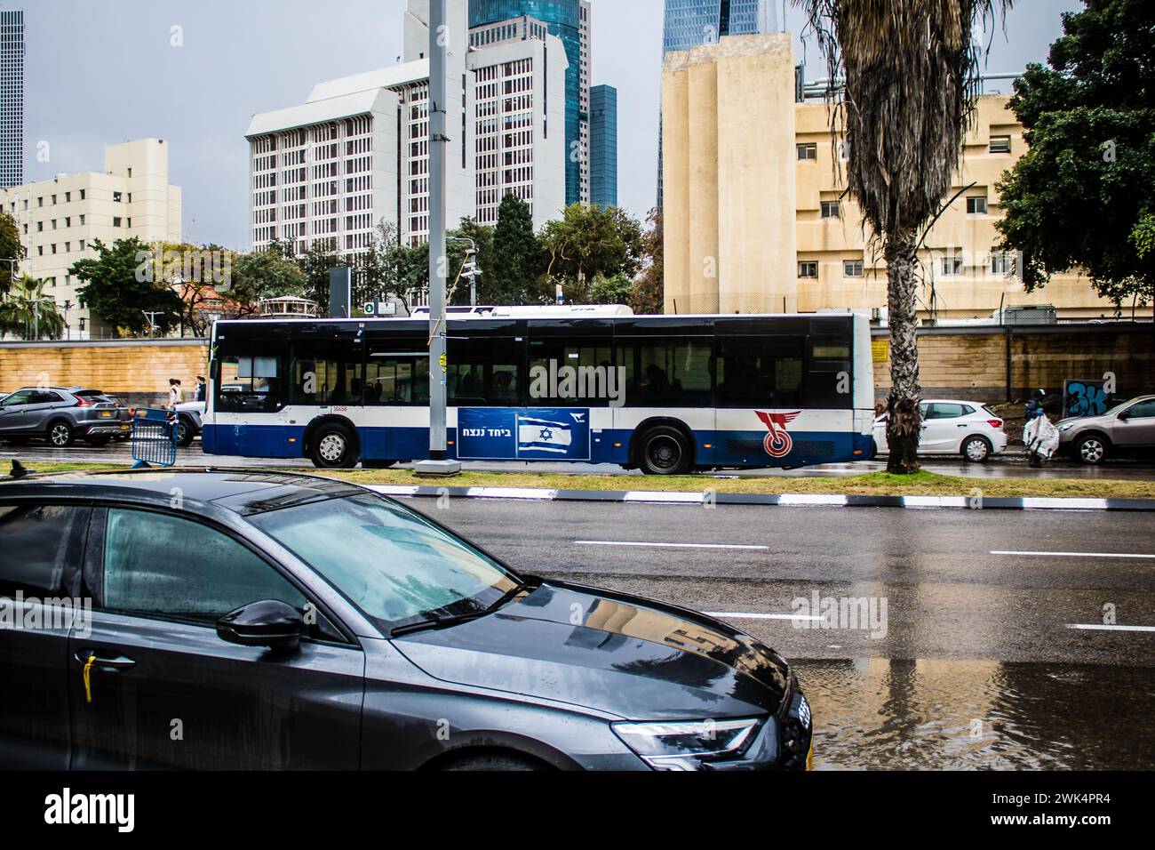 Tel Aviv, Israel, February 18, 2024 Local israeli bus under the rain ...