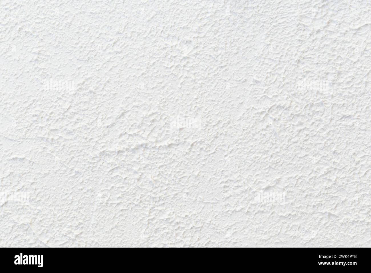 Close-up of abstract white uneven and rough surface. High resolution full frame textured background, copy space. Stock Photo