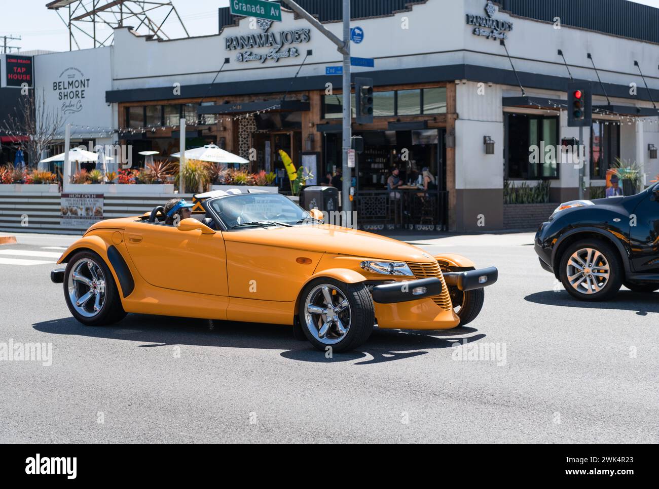 Long Beach, California USA - March 31, 2021: classic car of yellow Chrysler Plymouth Prowler on road Stock Photo