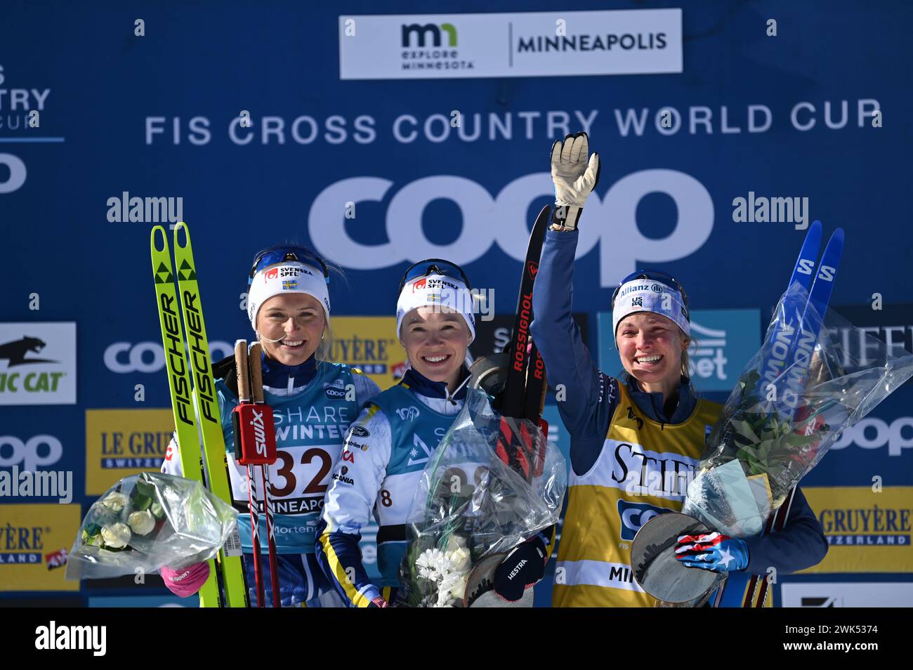 Minneapolis, Minnesota, USA, 18 February, 2024: American Jessie Diggins, right, on the podium after finishing third in the womern's 10-k FIS world cup cross country ski race at Theodore Wirth Regional Park in Minneapolis, Minnesota, USA.  Center, winner Jonna Sundling (SWEDEN); left, second place finisher Frida Karlsson (SWEDEN). Diggins is from Minnesota and the crowd loved her. Credit: John Lazenby/Alamy Live News Stock Photo