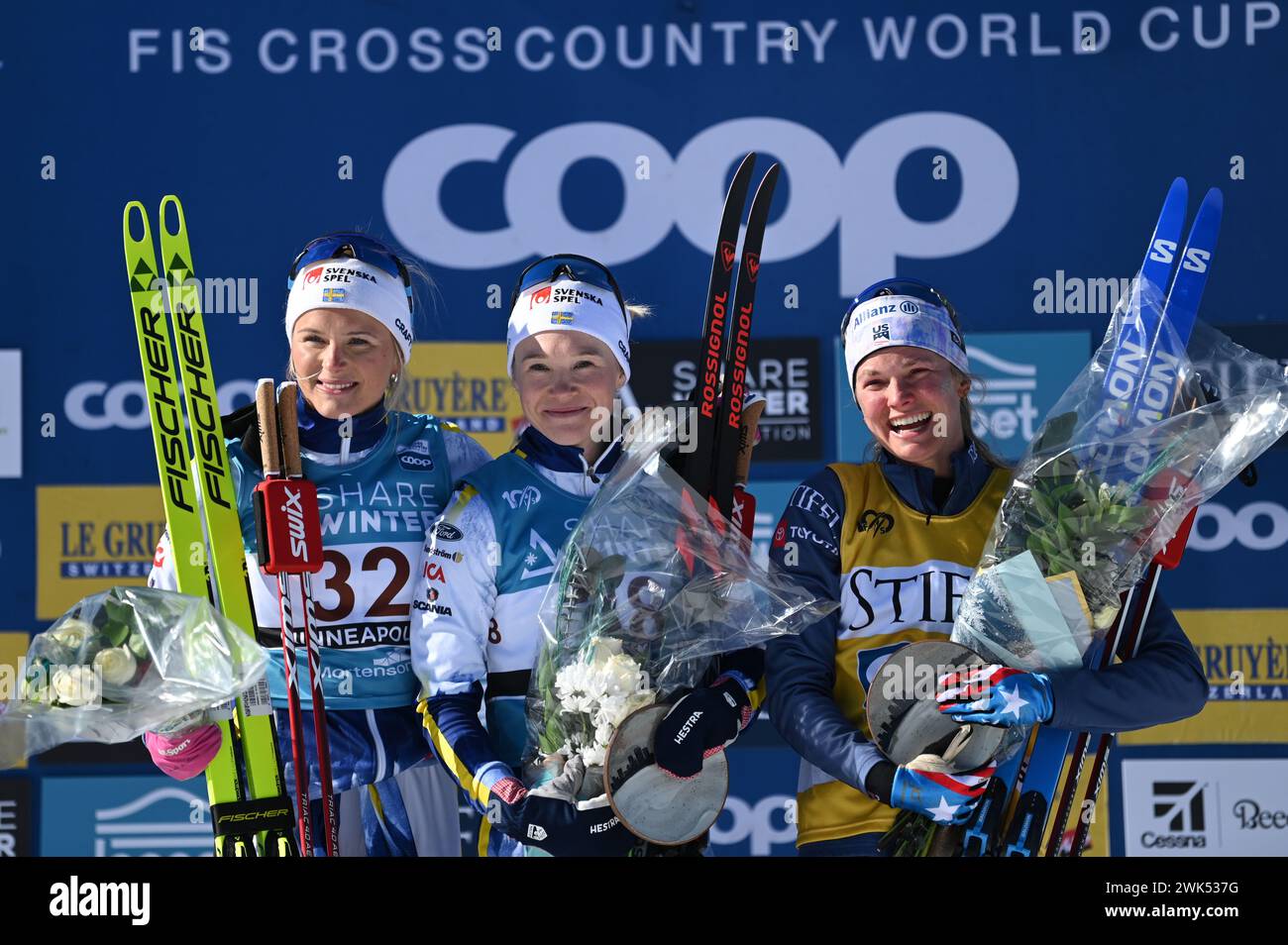 Minneapolis, Minnesota, USA, 18 February, 2024: American Jessie Diggins, right, on the podium after finishing third in the womern's 10-k FIS world cup cross country ski race at Theodore Wirth Regional Park in Minneapolis, Minnesota, USA.  Center, winner Jonna Sundling (SWEDEN); left, second place finisher Frida Karlsson (SWEDEN). Diggins is from Minnesota and the crowd loved her. Credit: John Lazenby/Alamy Live News Stock Photo