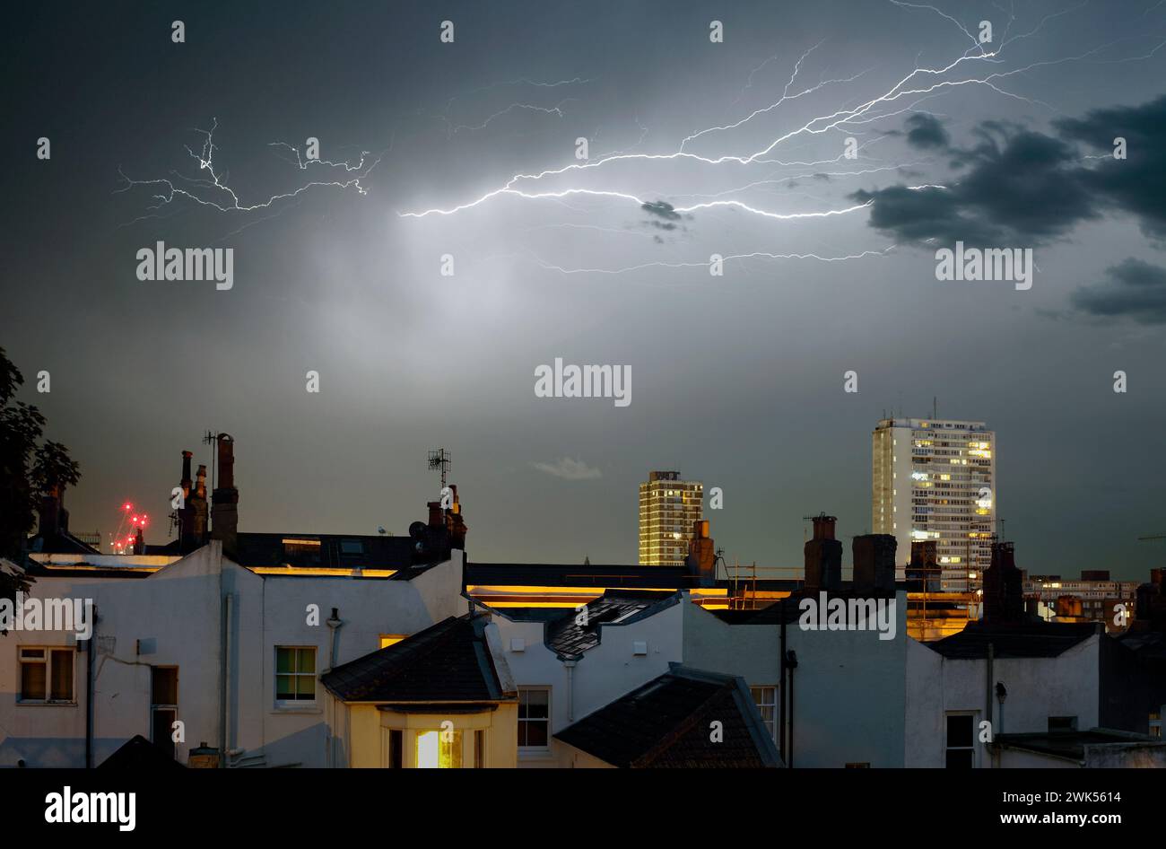 A summer storm lights up the night sky over Brighton. Stock Photo
