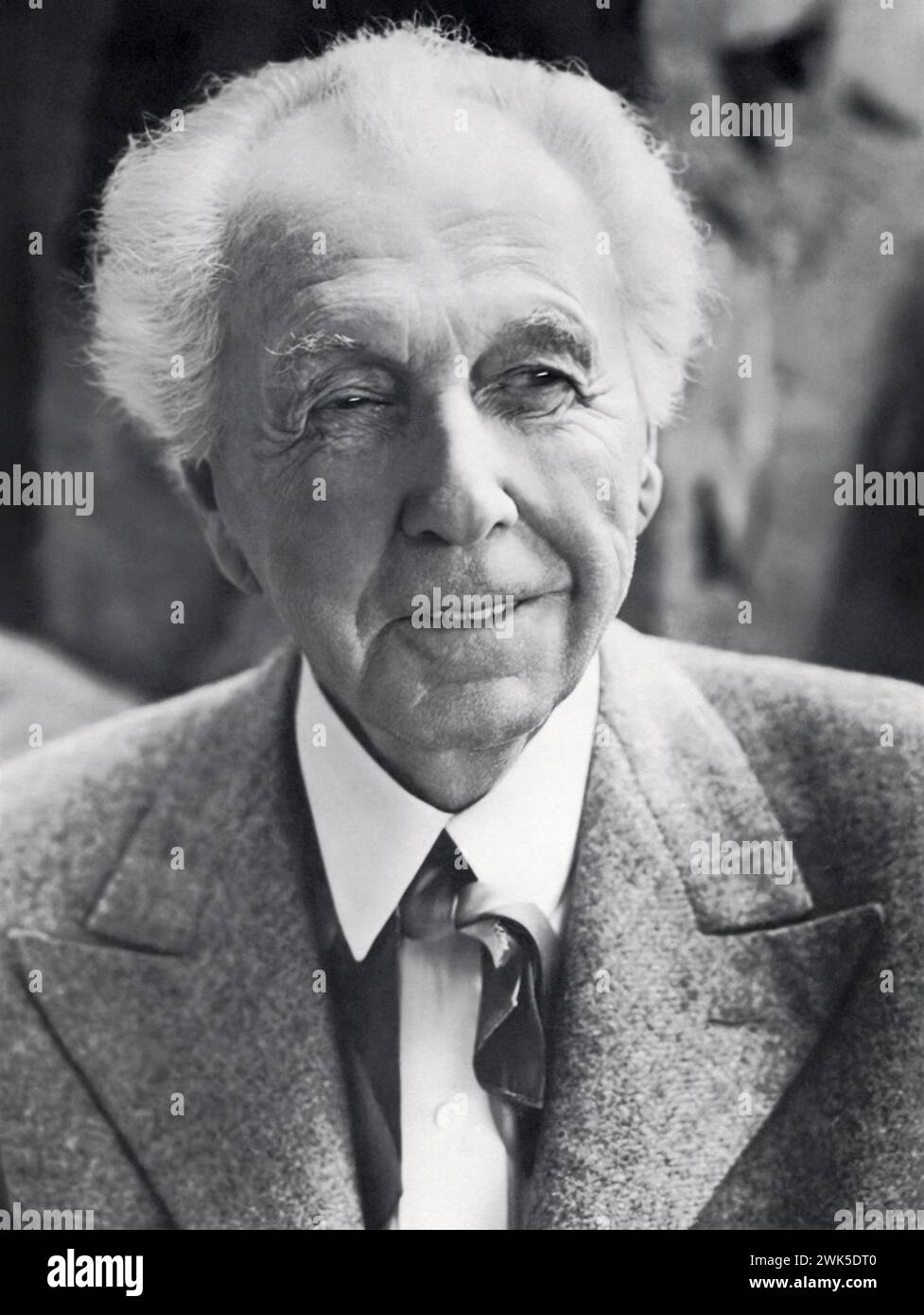 Frank Lloyd Wright (1867-1959), American architect pioneer of the Prairie School movement, in a portrait from the early 1950s. Wright would later be recognized (in 1991) by the American Institute of Architects as 'the greatest American architect of all time.' Stock Photo
