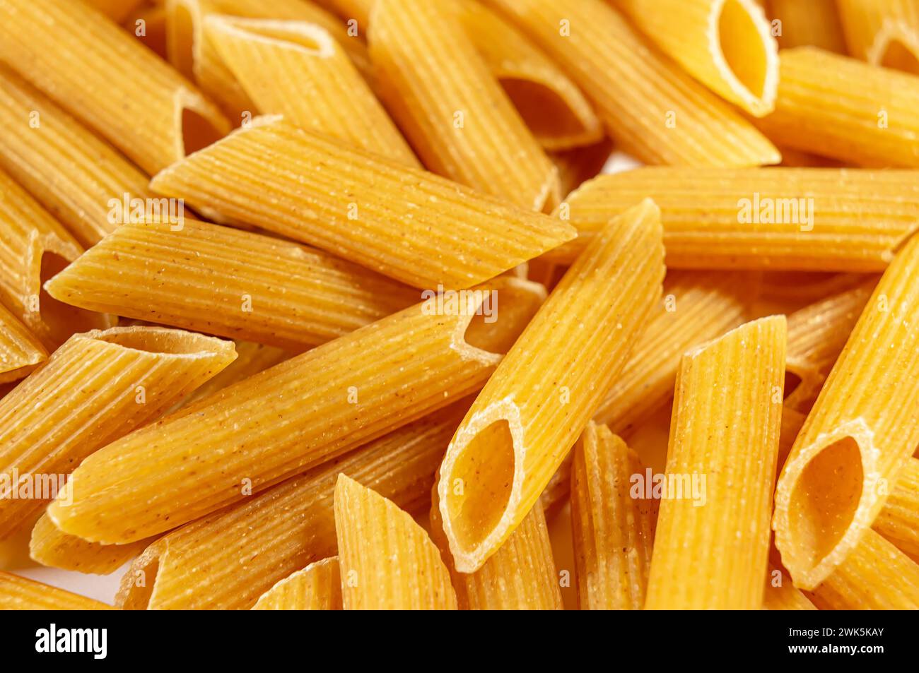 Organic wholemeal pasta. Captivating close-up of a delightful heap of ...