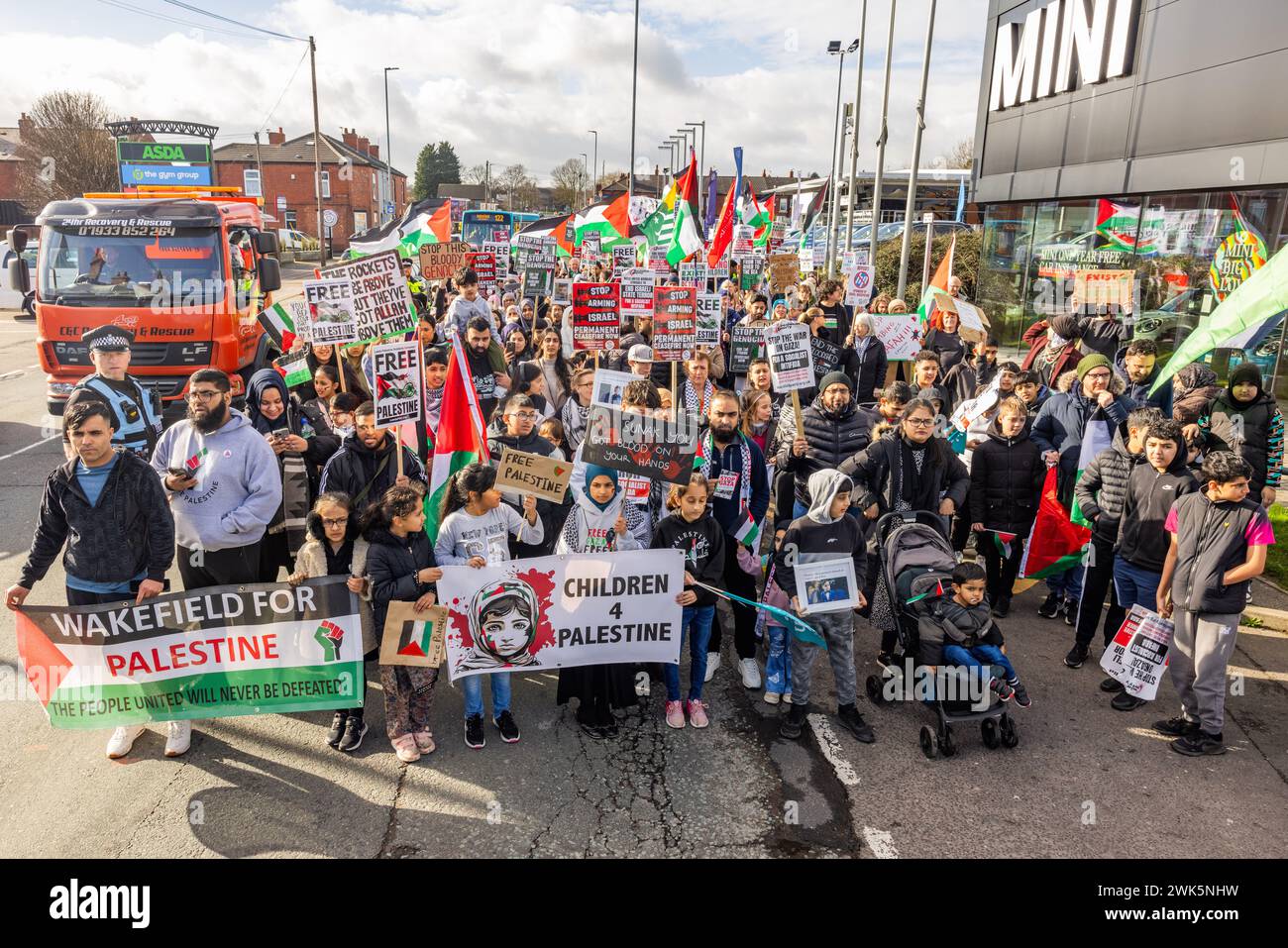 Wakefield, UK. 18 FEB, 2024. Group of pro palestine demonstrators gather on Wakefields first ever Palestine march. The march was led by several children holding various Wakefield for Palestine and Children for Palestine banners. The March started At ASDA on Dewsbury road and made its way into Wakefield city center. Credit Milo Chandler/Alamy Live News Stock Photo