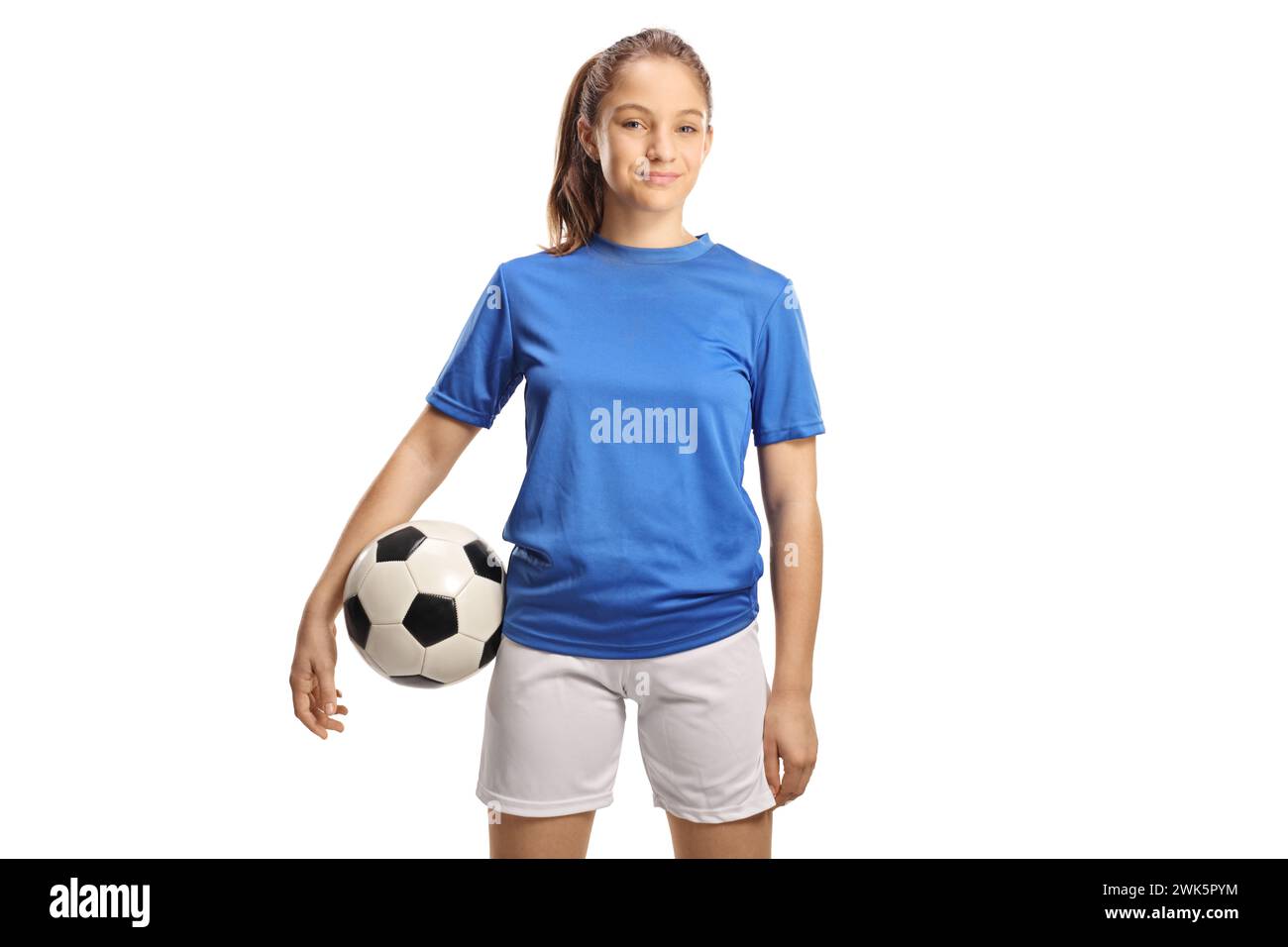 Teenage girl in a football jersey holding a ball isolated on white background Stock Photo