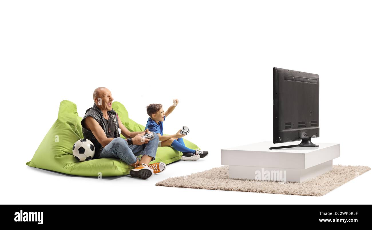 Мan playing football video game with a kid in front of a tv isolated on white background Stock Photo